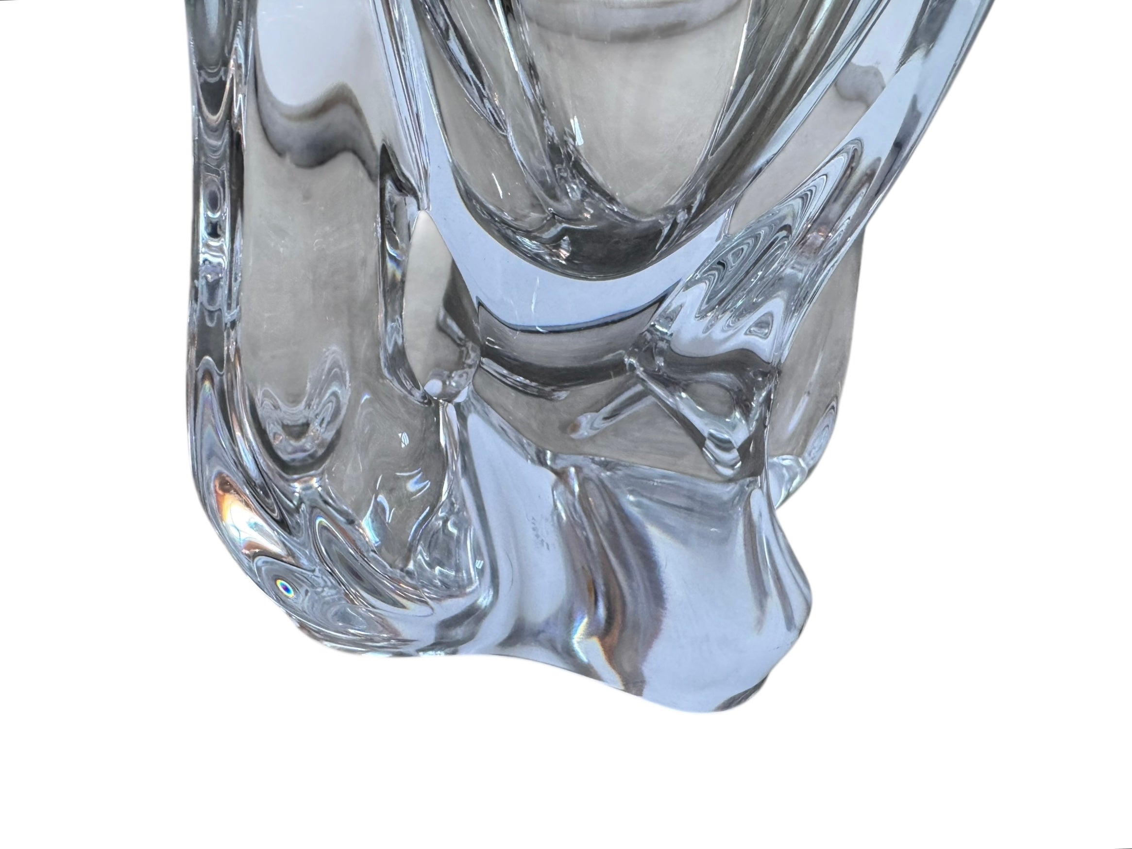 A clear crystal vase with a flared opening and a twisted, sculptural base.
The provided image is of a vintage Vannes Le Châtel crystal vase, which is a piece of French art glass
