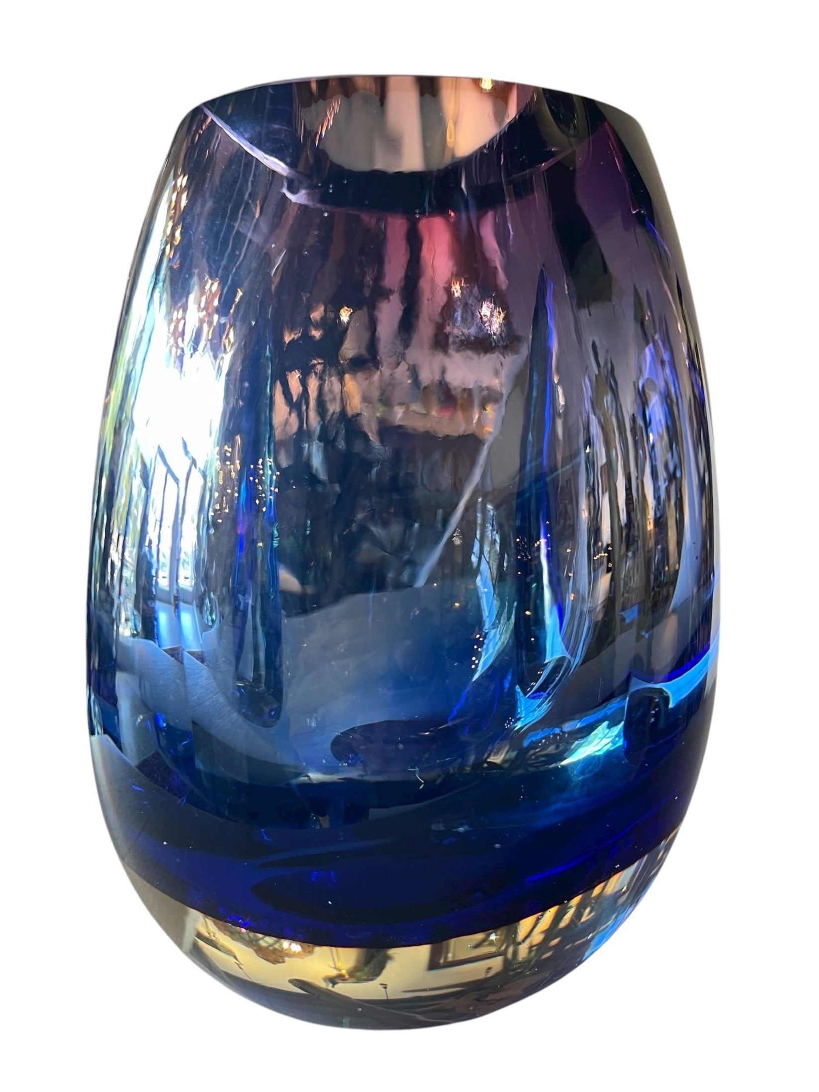 Sommerso glass vase with flattened sides creating a fish-eye effect, featuring cobalt and indigo colors and internal bubbles.