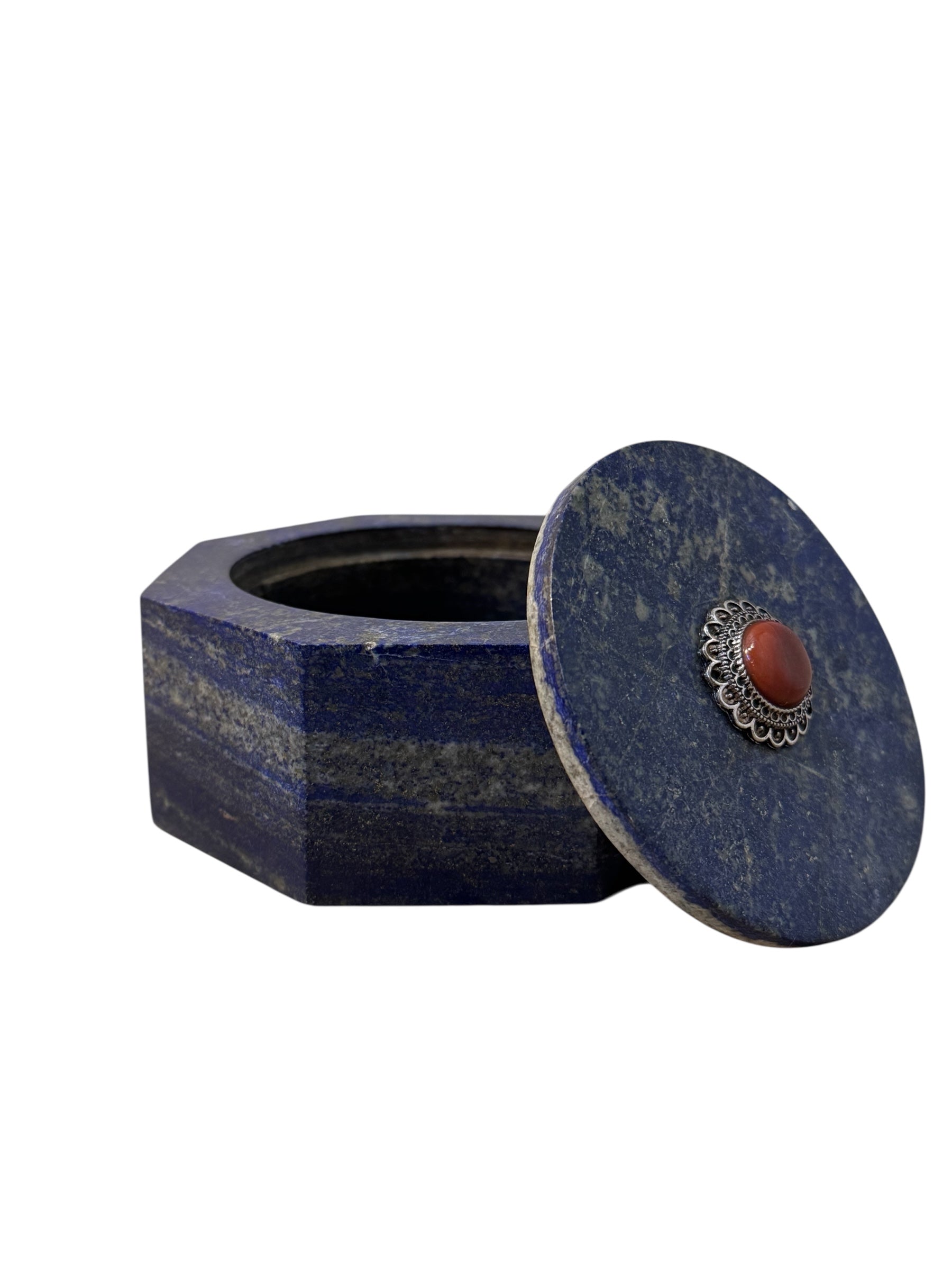 Hand-carved octagonal box made of lapis lazuli, featuring a red cabochon stone on its lid.