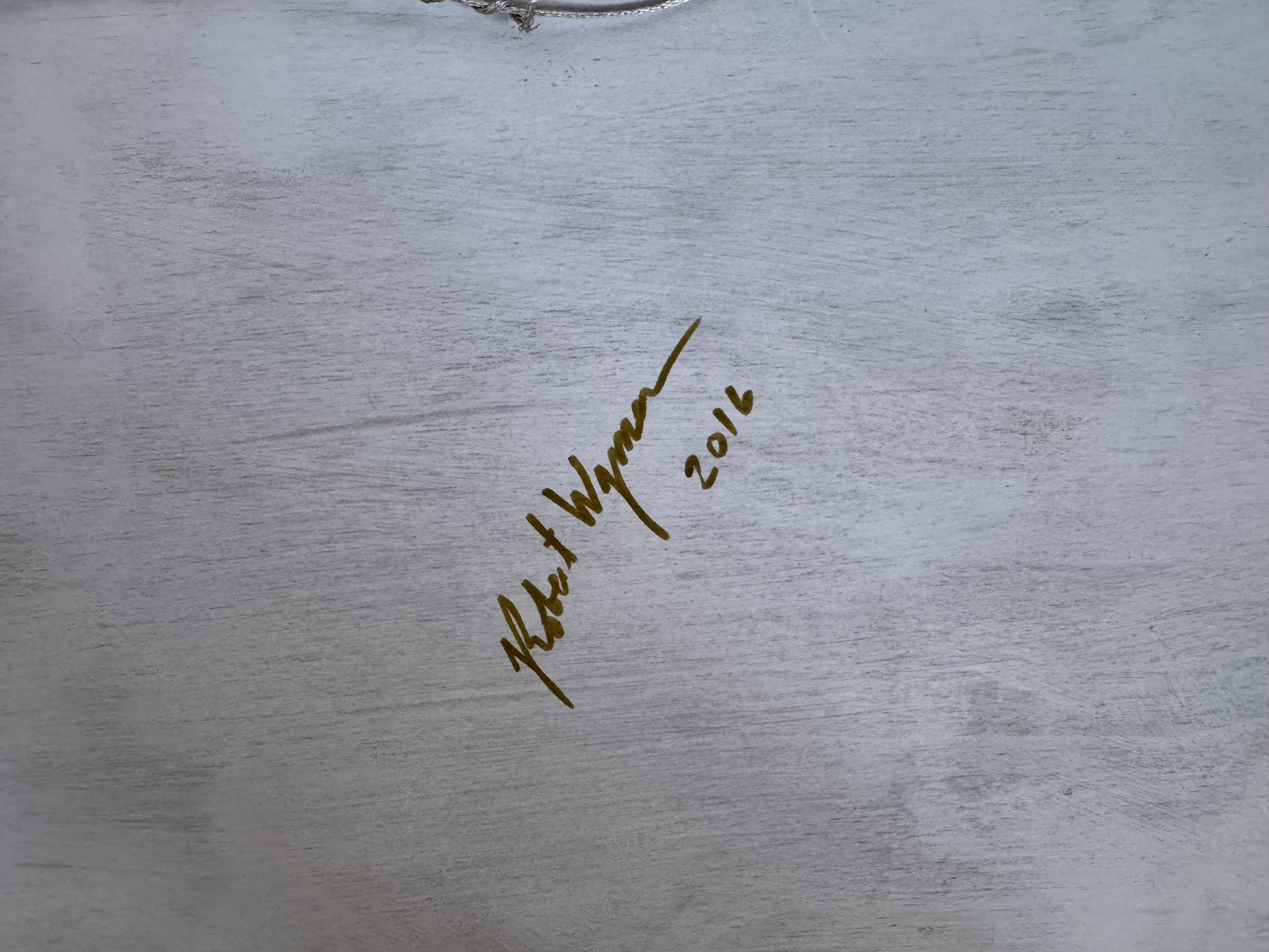 Signature and date on a textured metallic surface