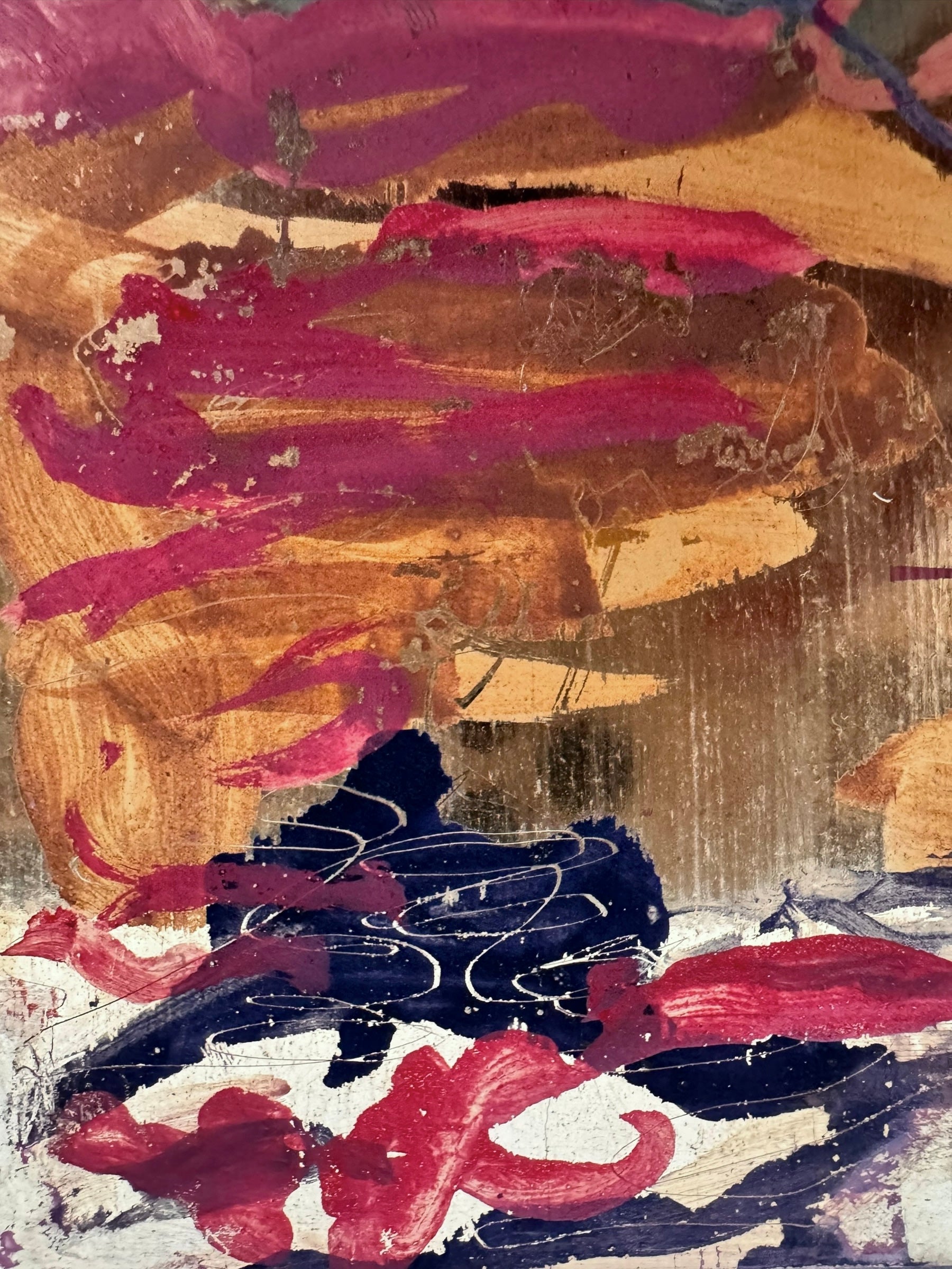 A vibrant abstract painting on a metallic gold-toned panel characterized by dense, energetic layering. The palette is dominated by saturated pinks, deep blacks, and earthy oranges.
In the upper half, horizontal strokes of orange and pink suggest a sunset or landscape, while the lower half features heavy, gestural applications of black paint that anchor the composition. Fine, white or silver linear scribbles are scratched into or layered over the pigment, adding a sense of frantic movement.