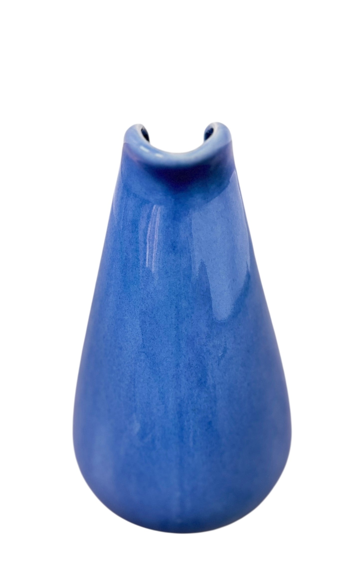 A Russel Wright American Modern stoneware water pitcher in a glossy Manitoga blue glaze is centered against a white background. The pitcher has a teardrop shape, a large handle, and a wide spout