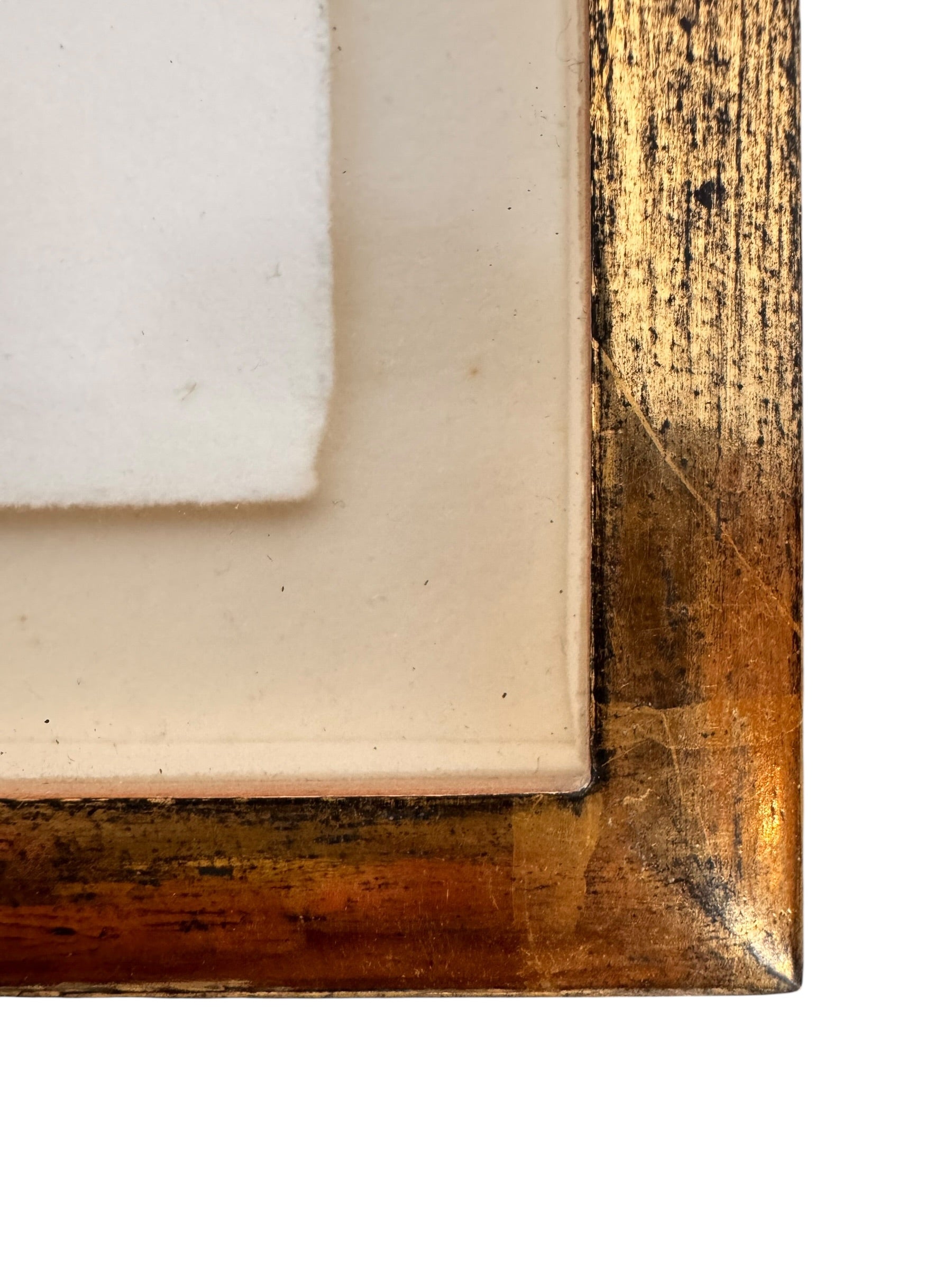 A vertical rectangular artwork, "Embers," by Jill London (2003), framed in a wide, textured gold frame. The piece features a small, abstract expressionist print at the center, rendered in dark, painterly strokes of deep blues, browns, yellows, and white, resembling moving water or smoke. Below the print, on the cream mat, the artist's signature, title, and date are hand-written in pencil. The paper has a delicate, textured deckled edge.