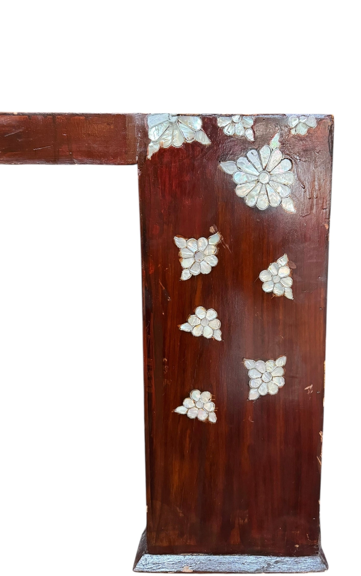 A rectangular, dark wood coffee table featuring scattered floral mother-of-pearl or shell inlays on its top surface and one side. The table has a modern, minimalist U-shaped design