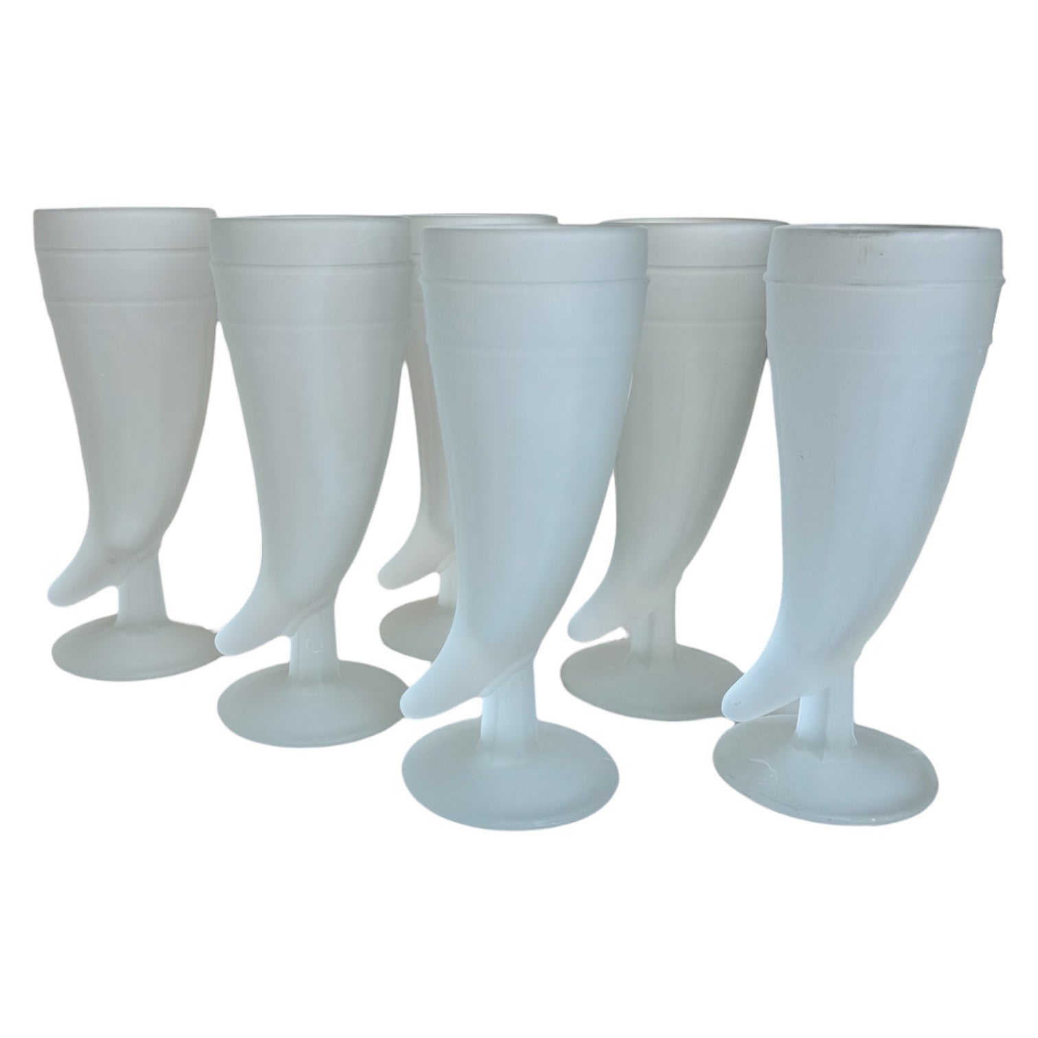 A set of six frosted glass drinking glasses with a matte finish, shaped like the horns of plenty. Indiana glass.