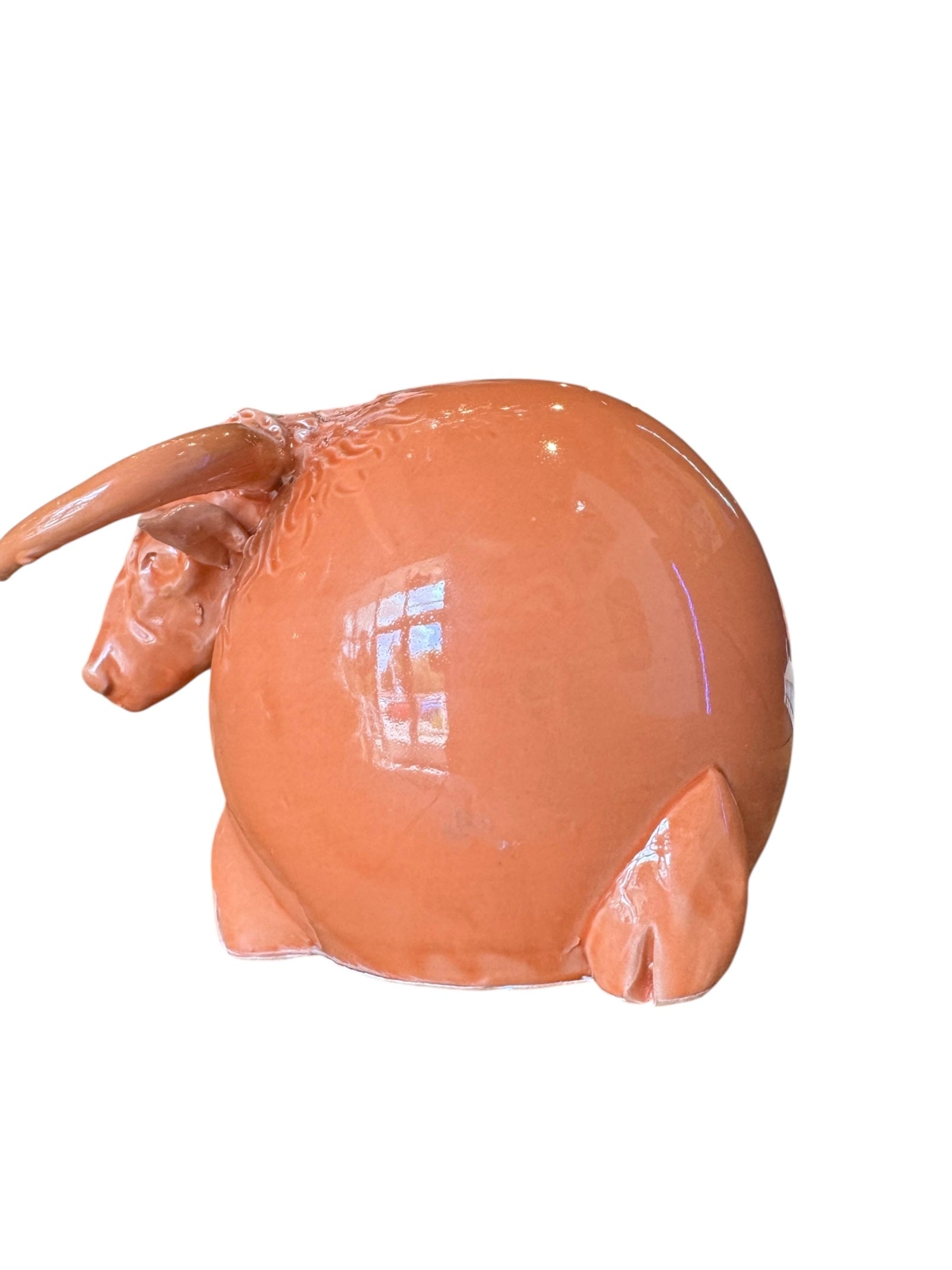 Terracotta Highland cow sculpture with a shaggy coat and curved horns