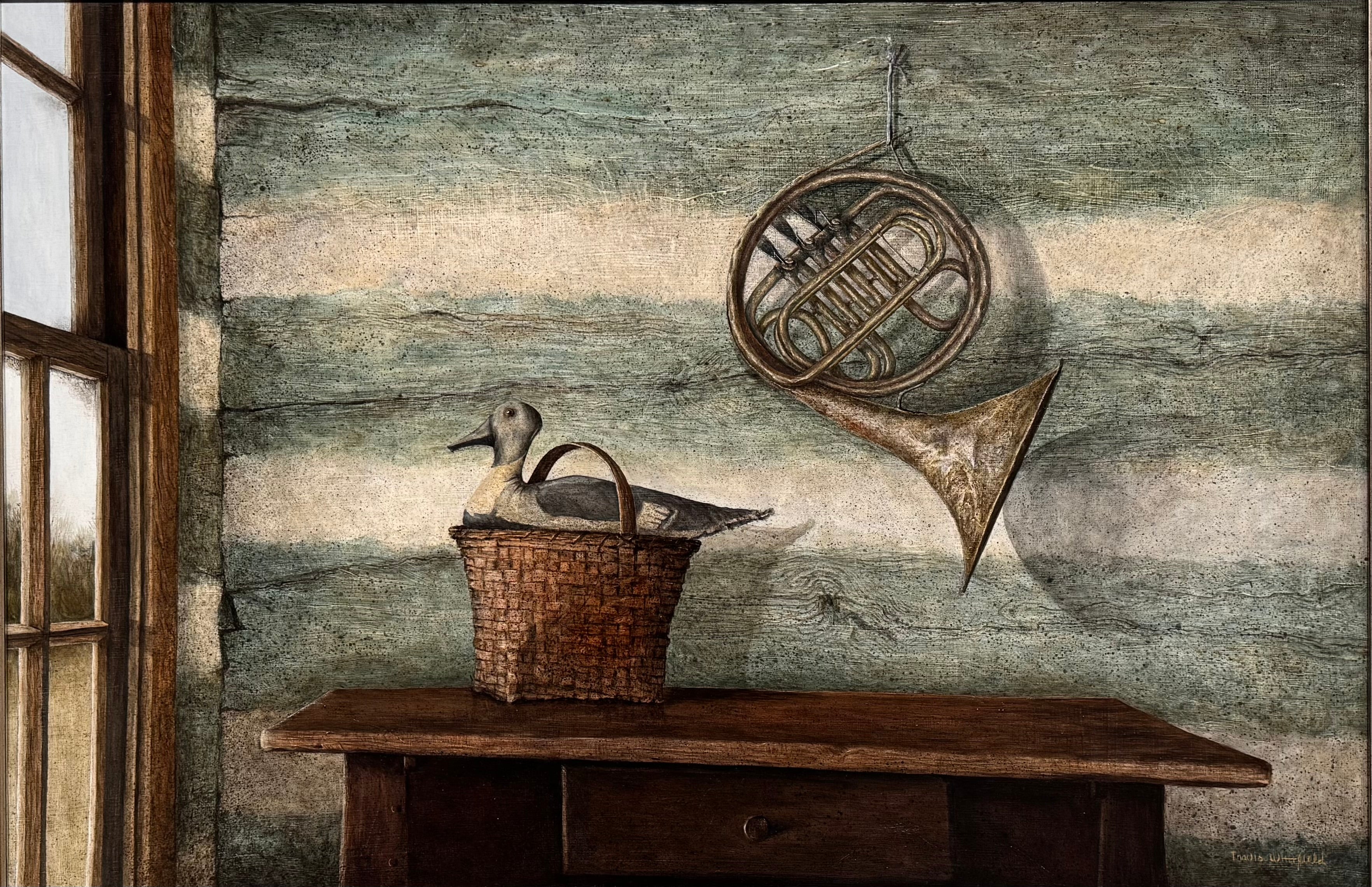 A realistic painting of a rustic interior scene by Travis Whitfield. A duck sits inside a woven basket on a dark wooden table with a single drawer. A French horn hangs on the light blue and white log wall behind the table. A multi-pane window on the left side of the painting shows an outdoor view.