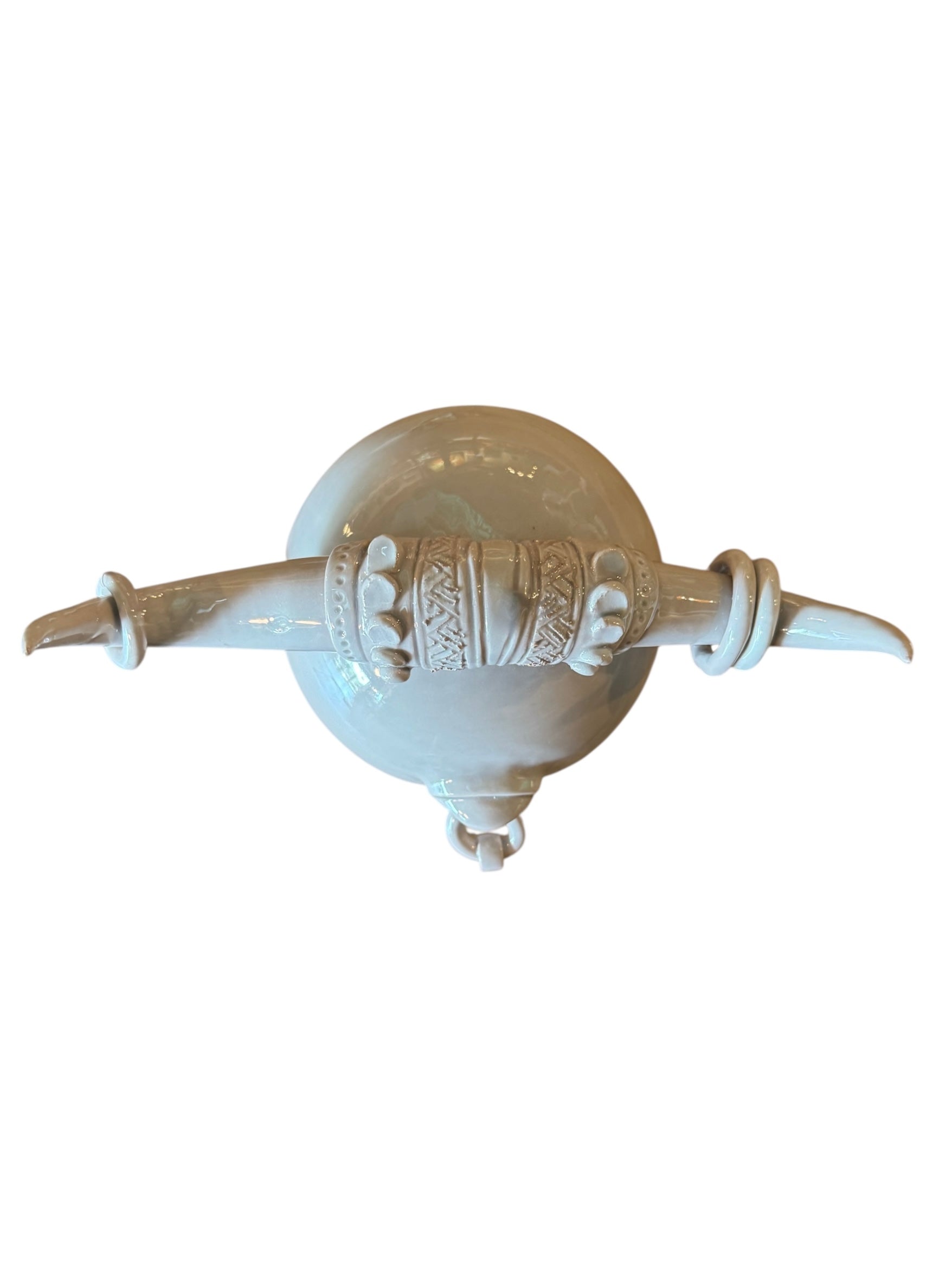 Artistic white grey ceramic bull sculpture by Enza Fasano, featuring a minimalist design and rings on the horns