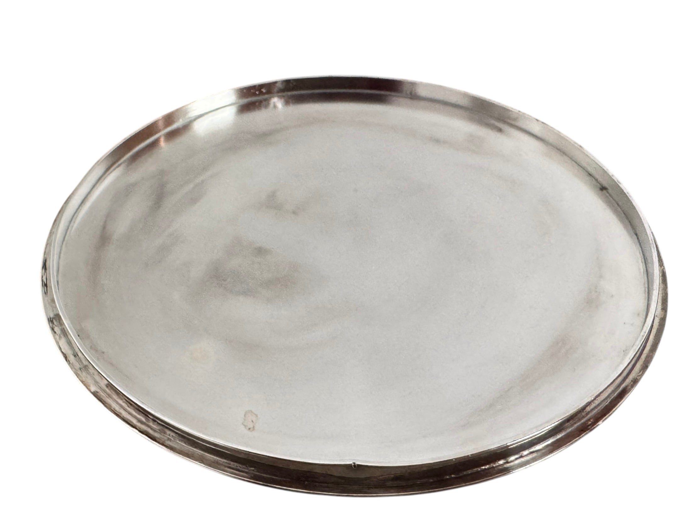 Round St. James silver-plated lidded serving dish from the 1980s, featuring a minimalist modernist design with geometric side handles and a sculptural, biomorphic finial, showing visible vintage wear and pitting on the metallic surface.