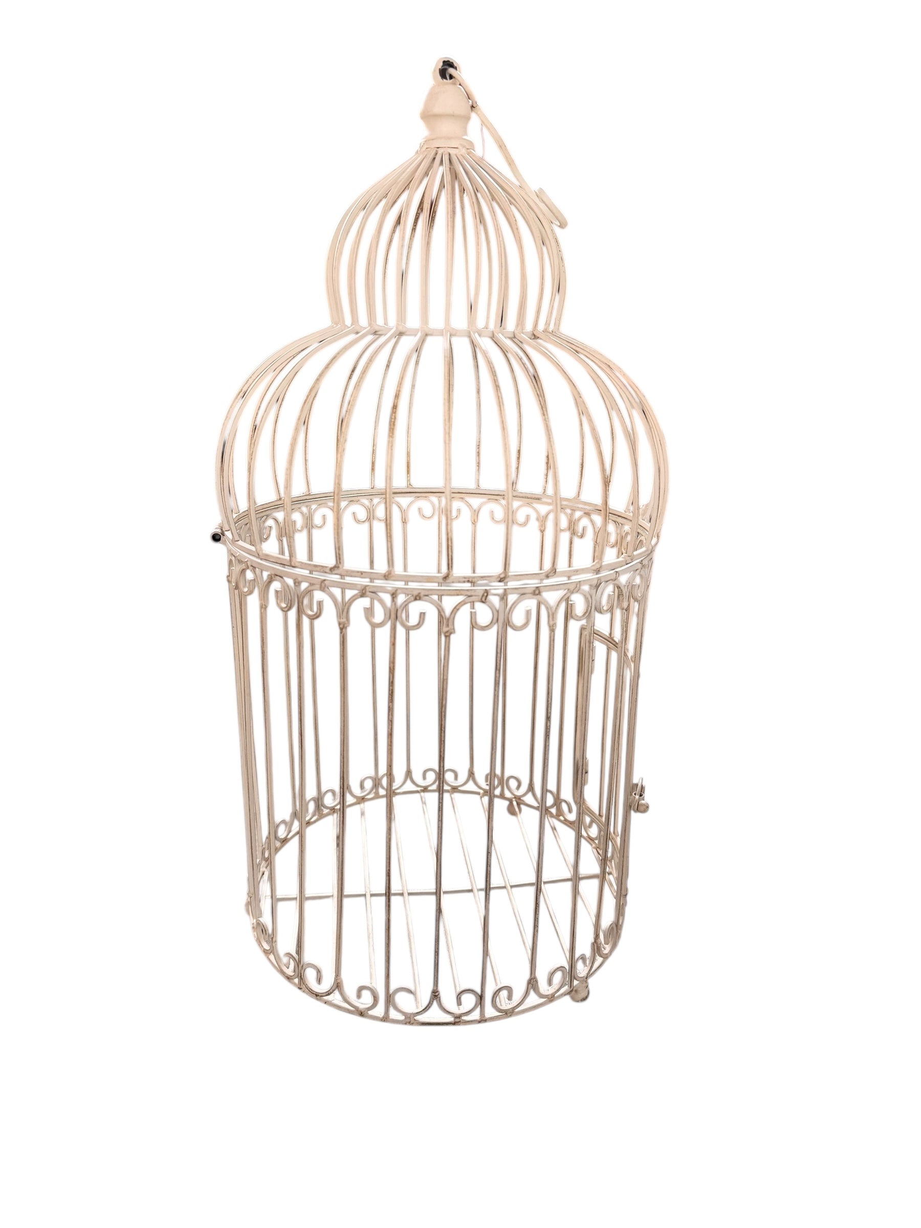 A single, white or cream-colored, decorative wrought iron bird cage with a hinged door and a hanging loop at the top. The cage has a vintage or antique style