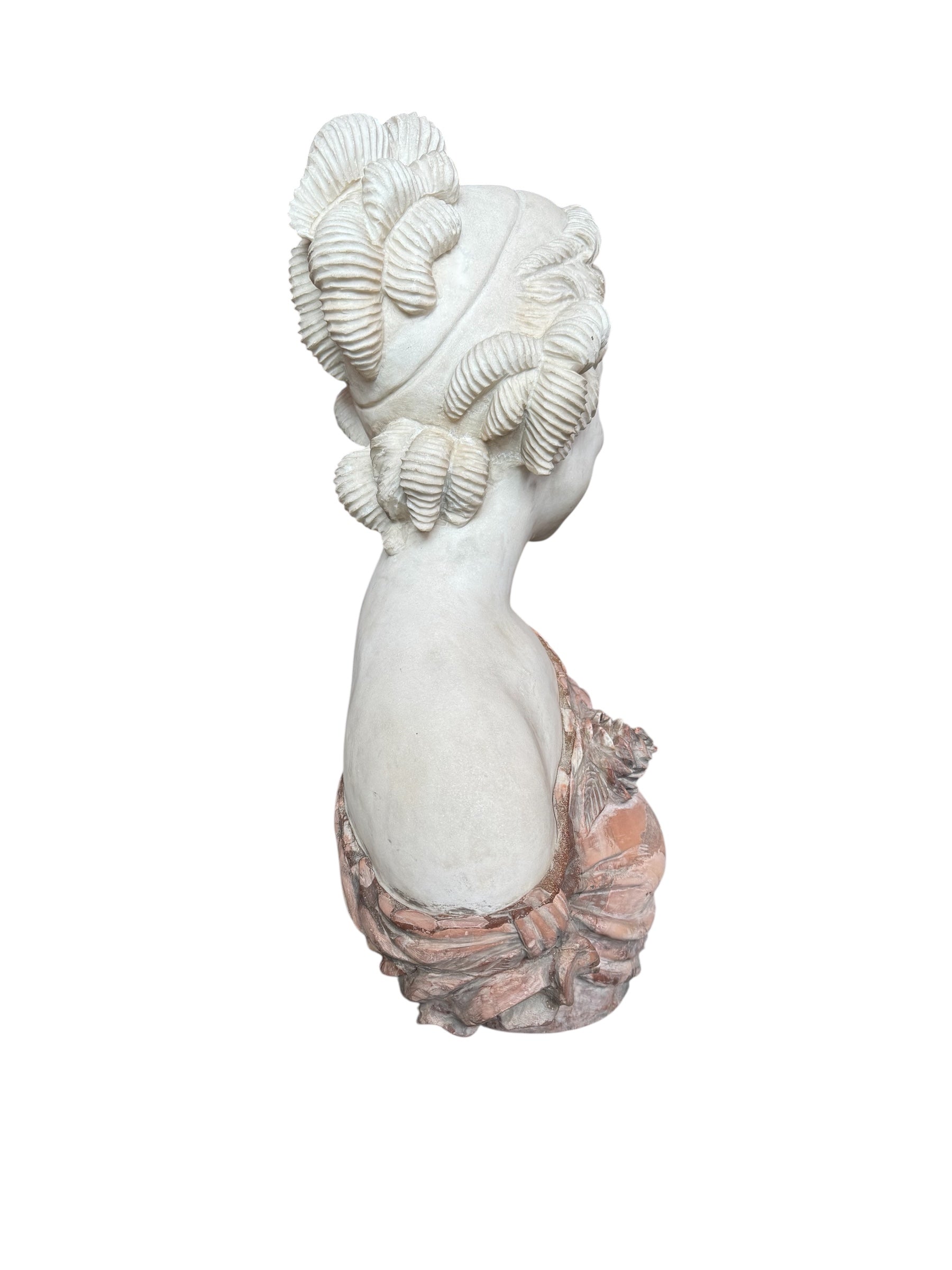 A 25-inch high polychrome marble bust of a woman, featuring white marble for her face and hair, with a base and draped fabric adorned with carved roses and leaves.
