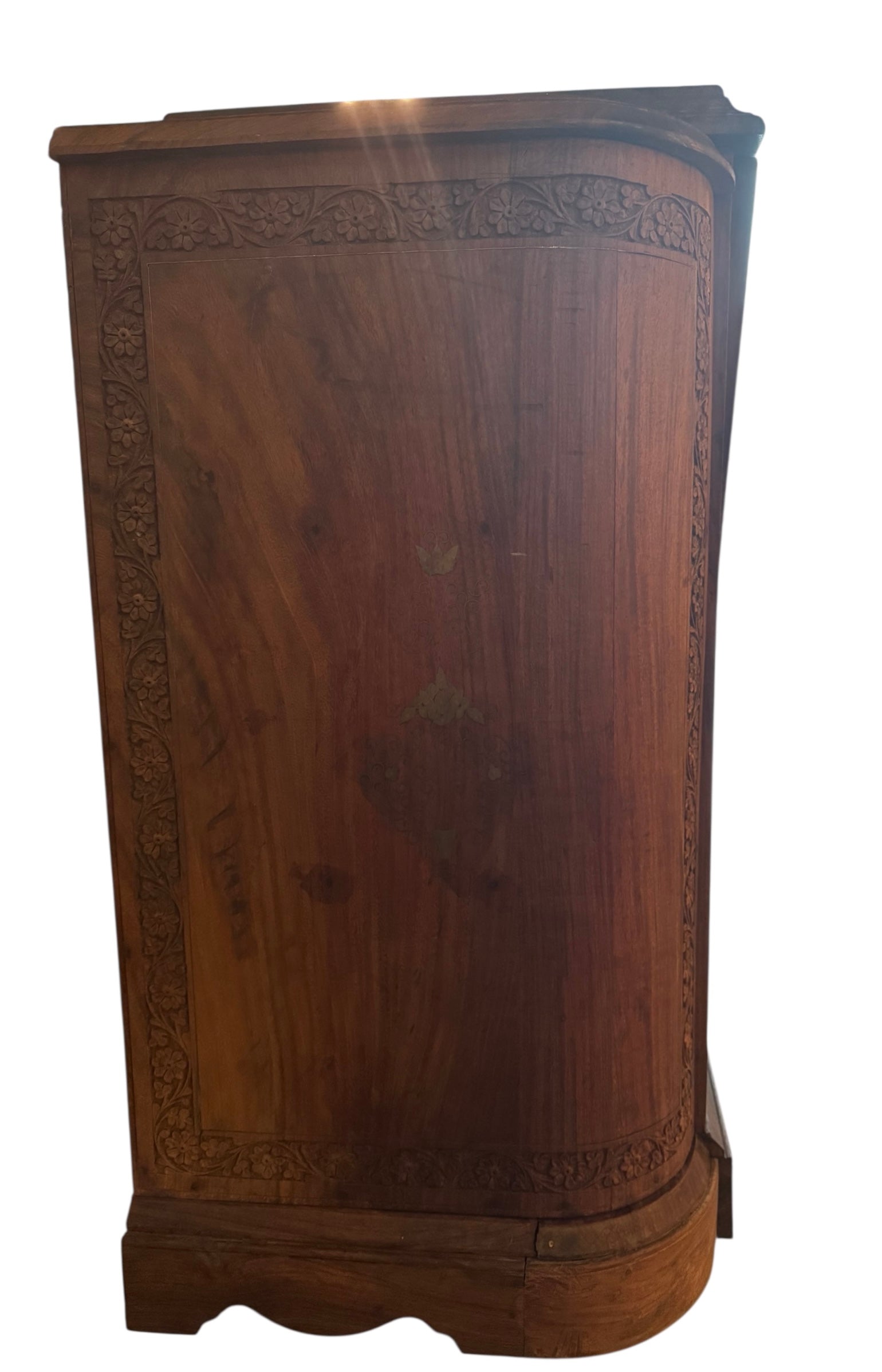 Antique bar cabinet with wood inlay and brass floral details, open to reveal interior shelving and bar storage