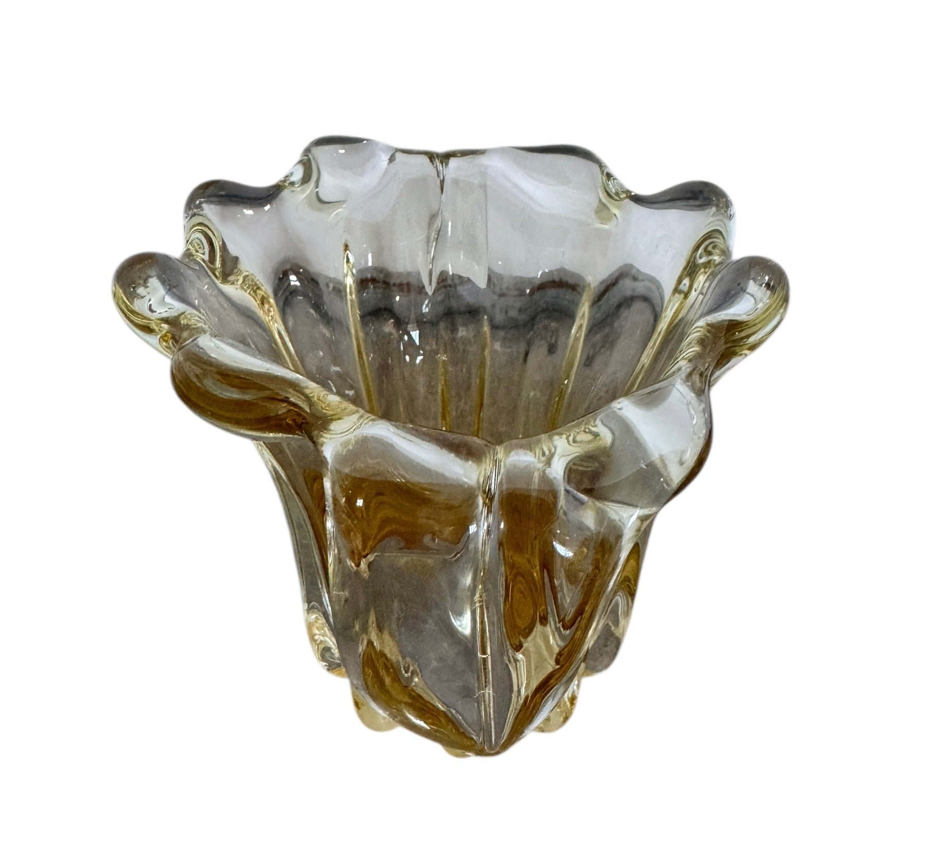 A hand-blown art glass vase with a scalloped, tulip-shaped rim, featuring an amber-to-clear color gradient and a ribbed base