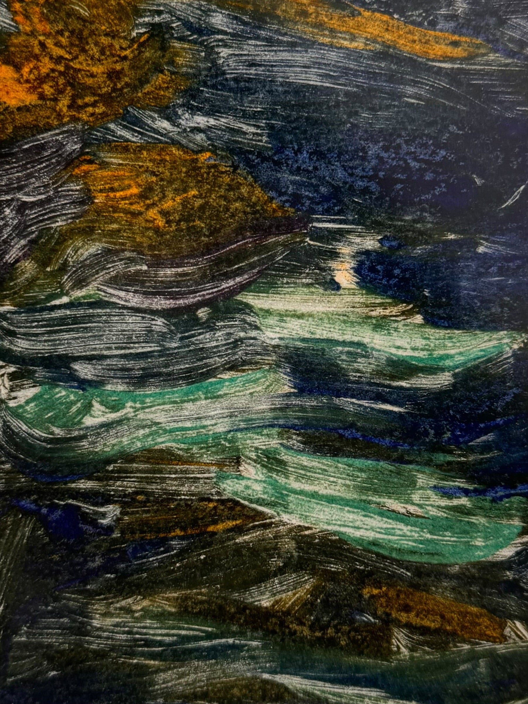 A vertical rectangular artwork, "Embers," by Jill London (2003), framed in a wide, textured gold frame. The piece features a small, abstract expressionist print at the center, rendered in dark, painterly strokes of deep blues, browns, yellows, and white, resembling moving water or smoke. Below the print, on the cream mat, the artist's signature, title, and date are hand-written in pencil. The paper has a delicate, textured deckled edge.