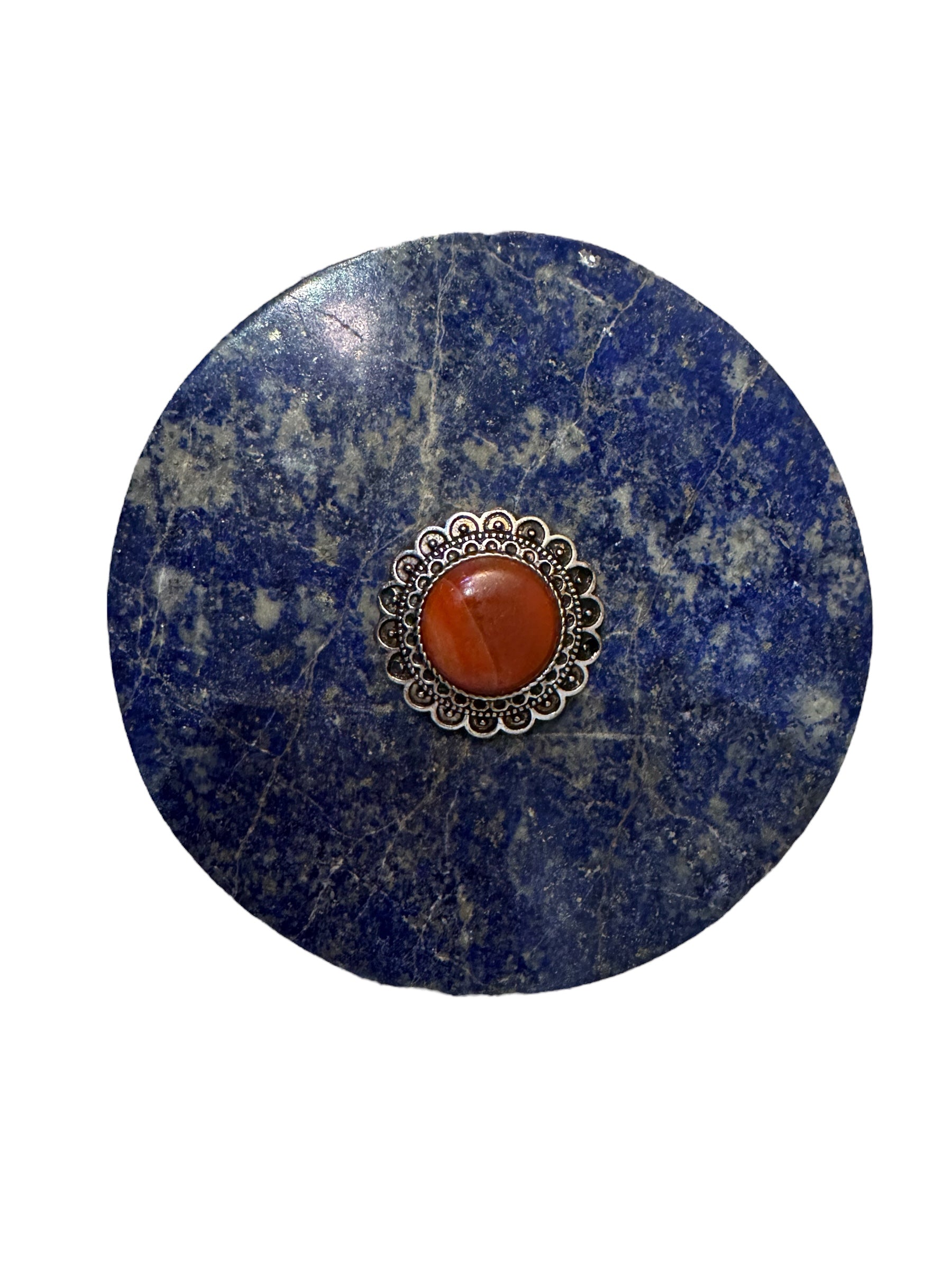 Hand-carved octagonal box made of lapis lazuli, featuring a red cabochon stone on its lid.