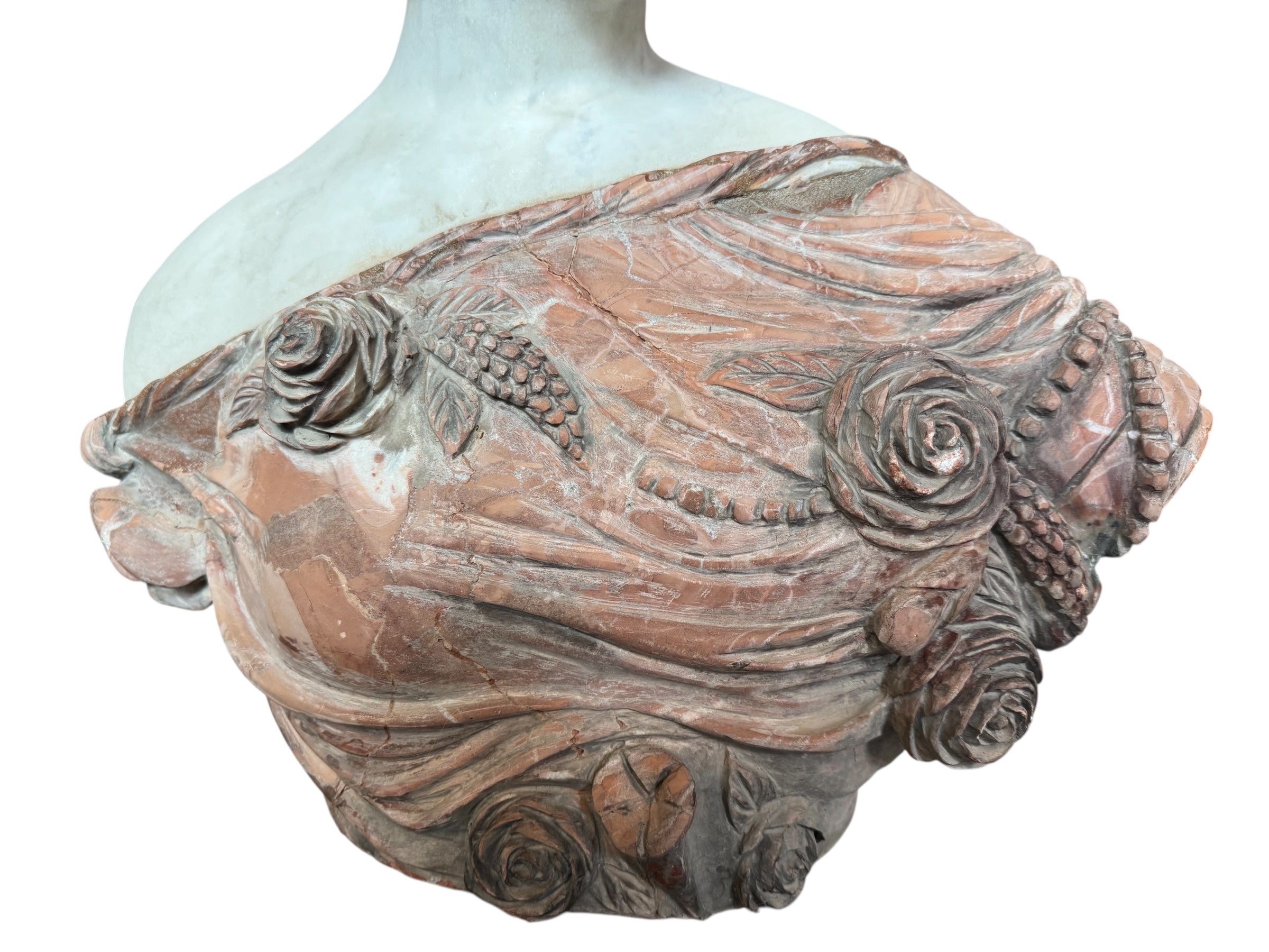 A 25-inch high polychrome marble bust of a woman, featuring white marble for her face and hair, with a base and draped fabric adorned with carved roses and leaves.