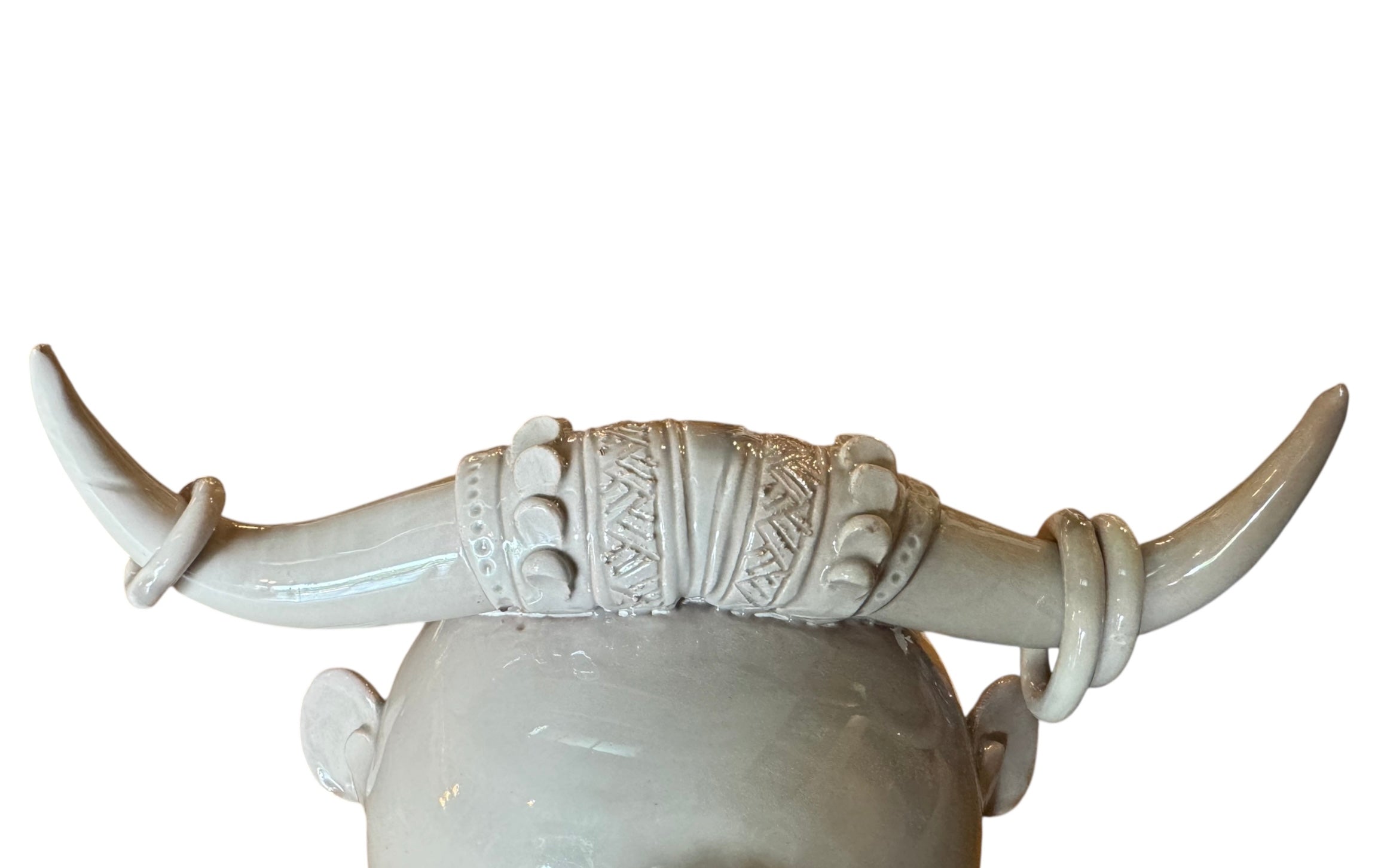 Artistic white grey ceramic bull sculpture by Enza Fasano, featuring a minimalist design and rings on the horns