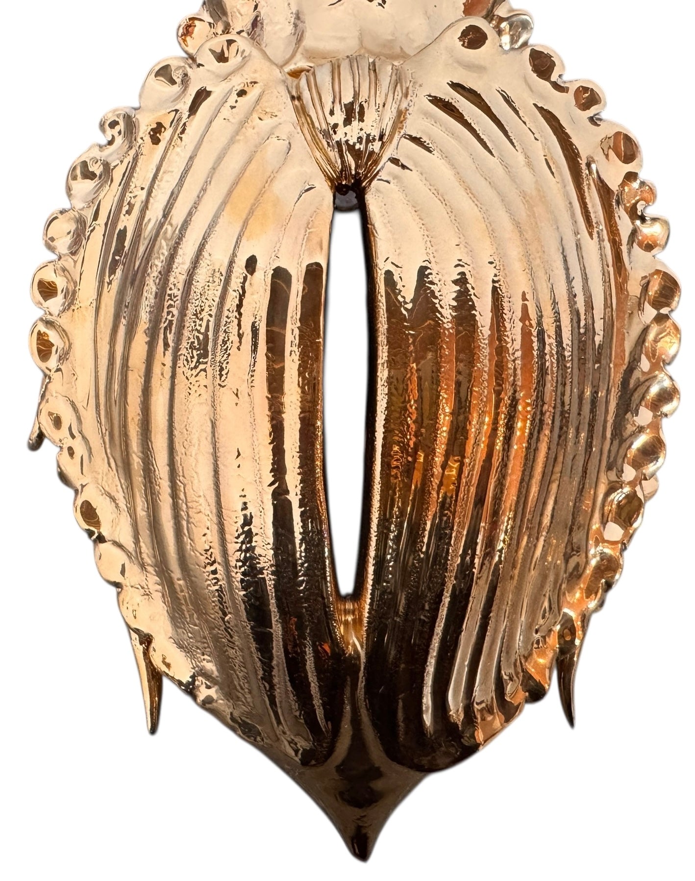 A handcrafted ceramic sculpture of a rhinoceros beetle by Enza Fasano, featuring a brilliant, high-gloss gold metallic finish. The beetle is captured in a dynamic, slightly upturned pose with detailed textures on its ribbed shell and prominent, curved horns. The piece reflects light across its polished surface, showcasing the artist’s signature fusion of traditional Pugliese pottery and contemporary luxury.