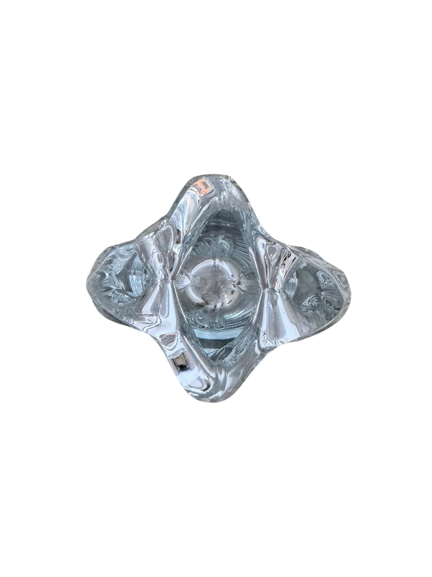 A clear crystal vase with a flared opening and a twisted, sculptural base.
The provided image is of a vintage Vannes Le Châtel crystal vase, which is a piece of French art glass