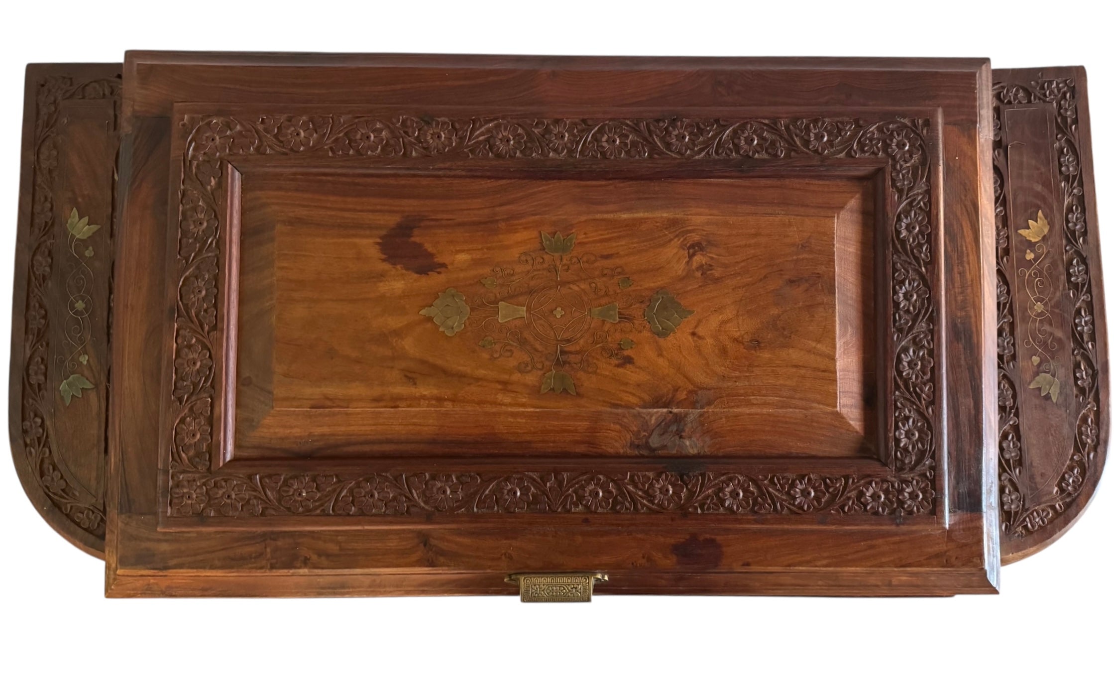 Antique bar cabinet with wood inlay and brass floral details, open to reveal interior shelving and bar storage