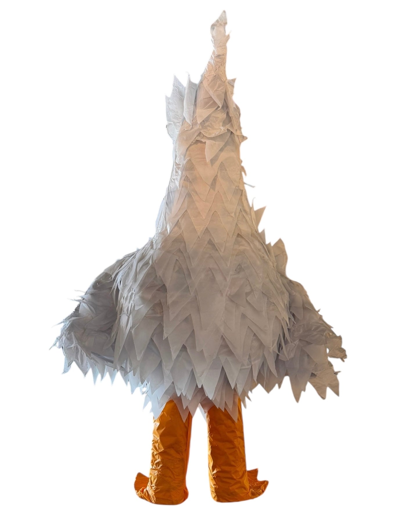 A white chicken pinata with red comb and wattles, and orange beak and legs, standing upright.