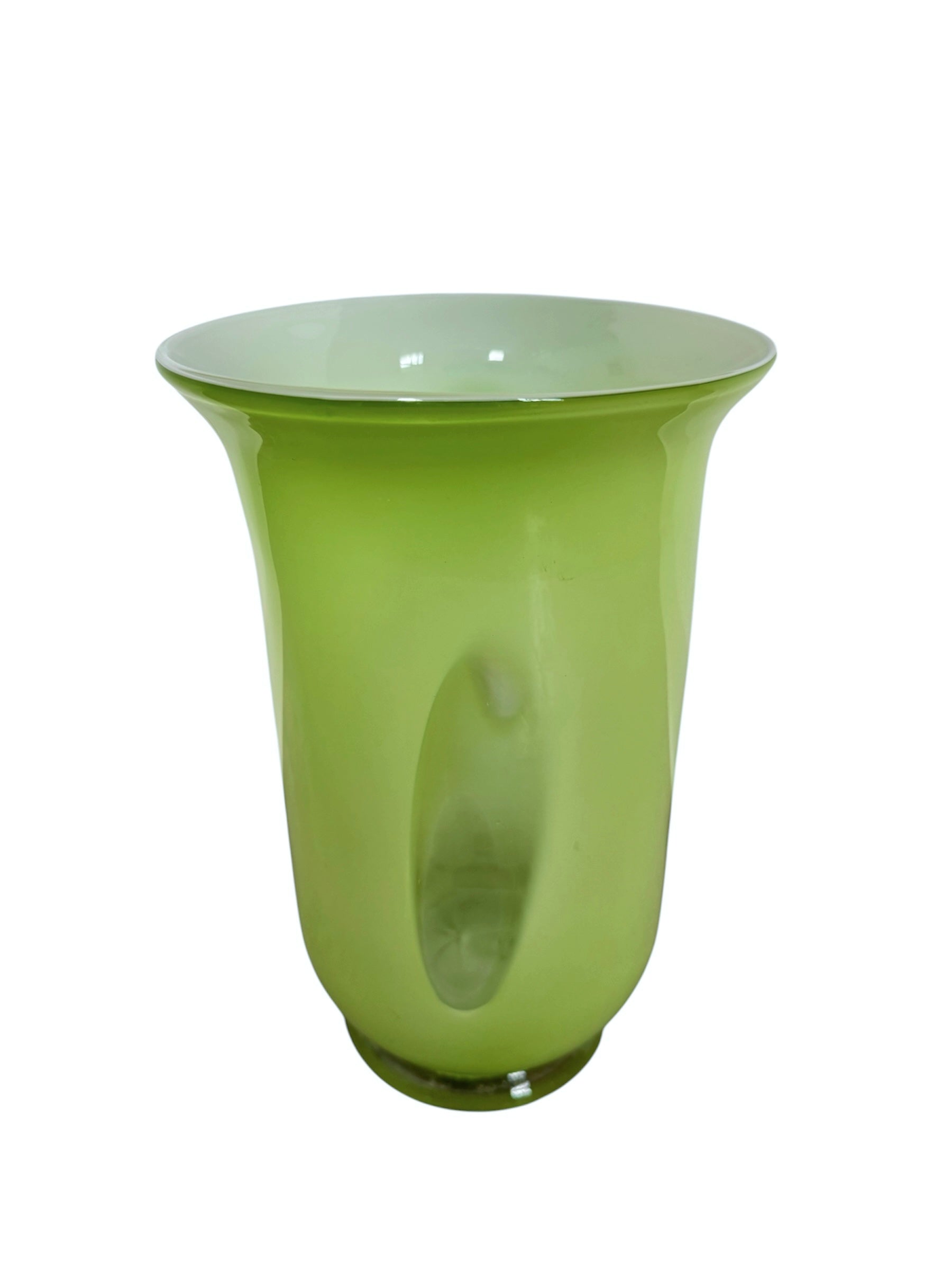 A mid-century modern, lime green cased-glass vase with a wide, flared rim and a thick, clear glass base. The exterior is a glossy chartreuse green, while the interior is lined with solid milk-white glass. The defining feature is a large, vertical oval cutout window that pierces directly through the center of the vase's body, creating an open-air negative space.