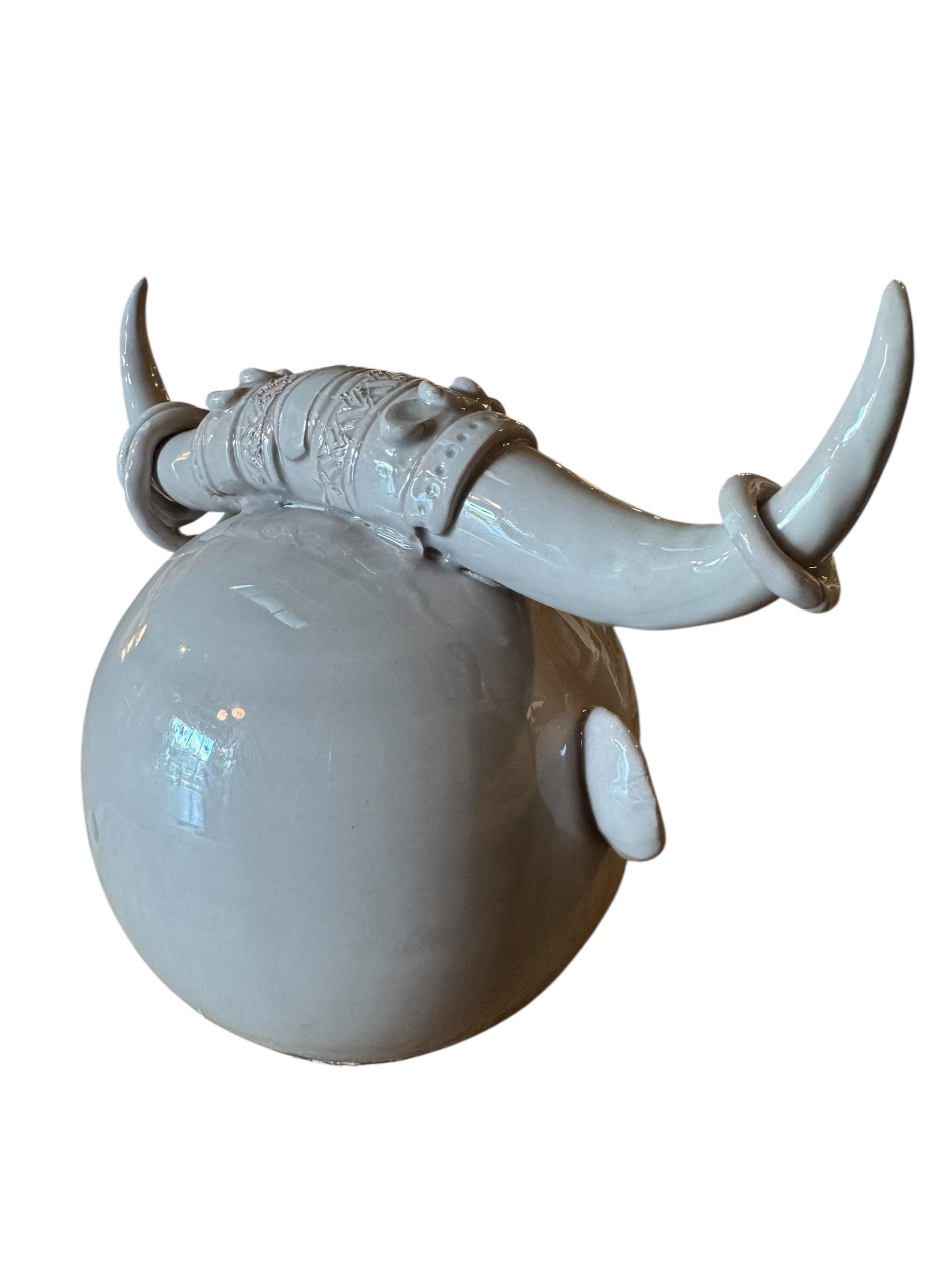 Artistic white grey ceramic bull sculpture by Enza Fasano, featuring a minimalist design and rings on the horns
