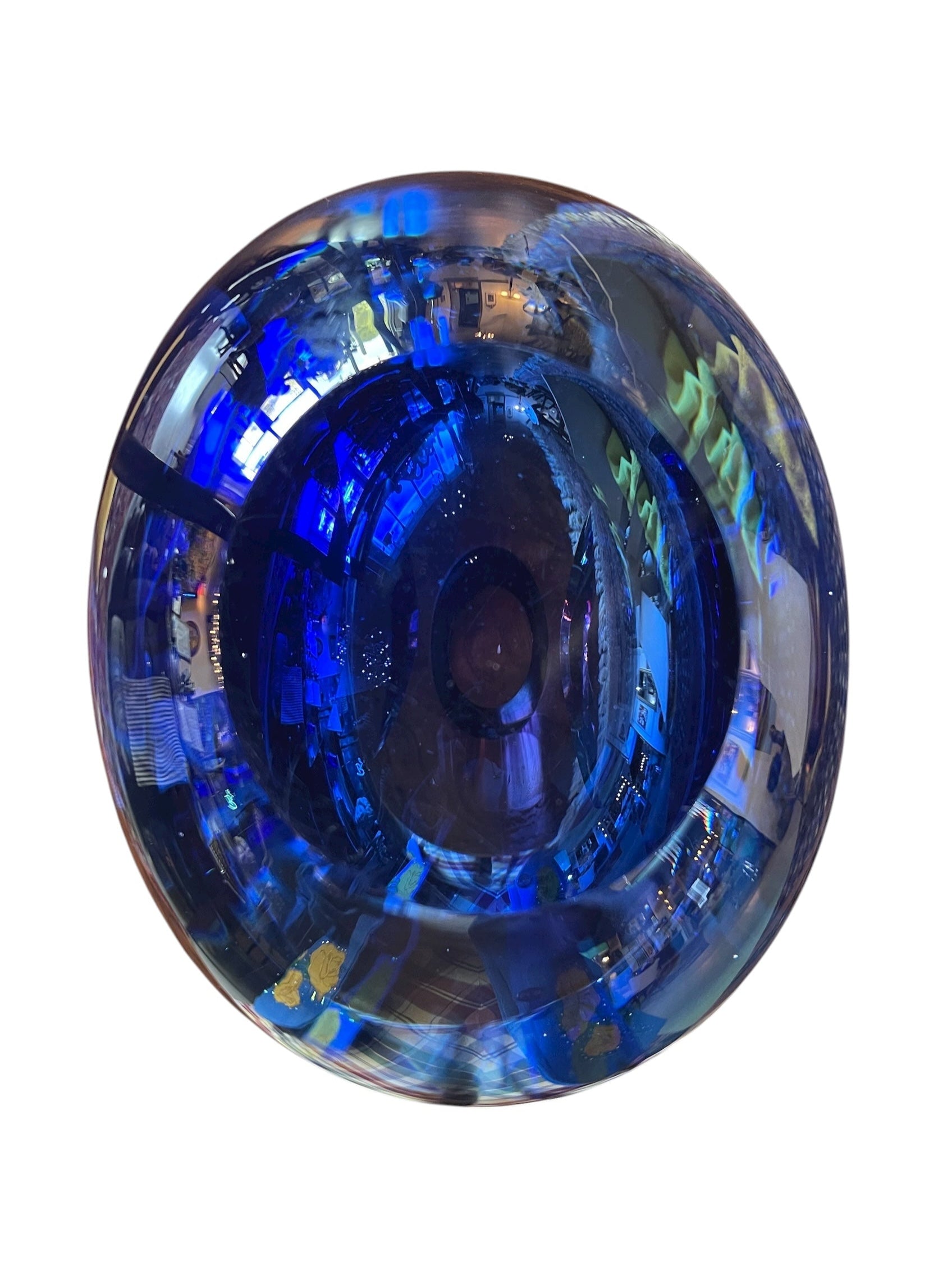 Sommerso glass vase with flattened sides creating a fish-eye effect, featuring cobalt and indigo colors and internal bubbles.