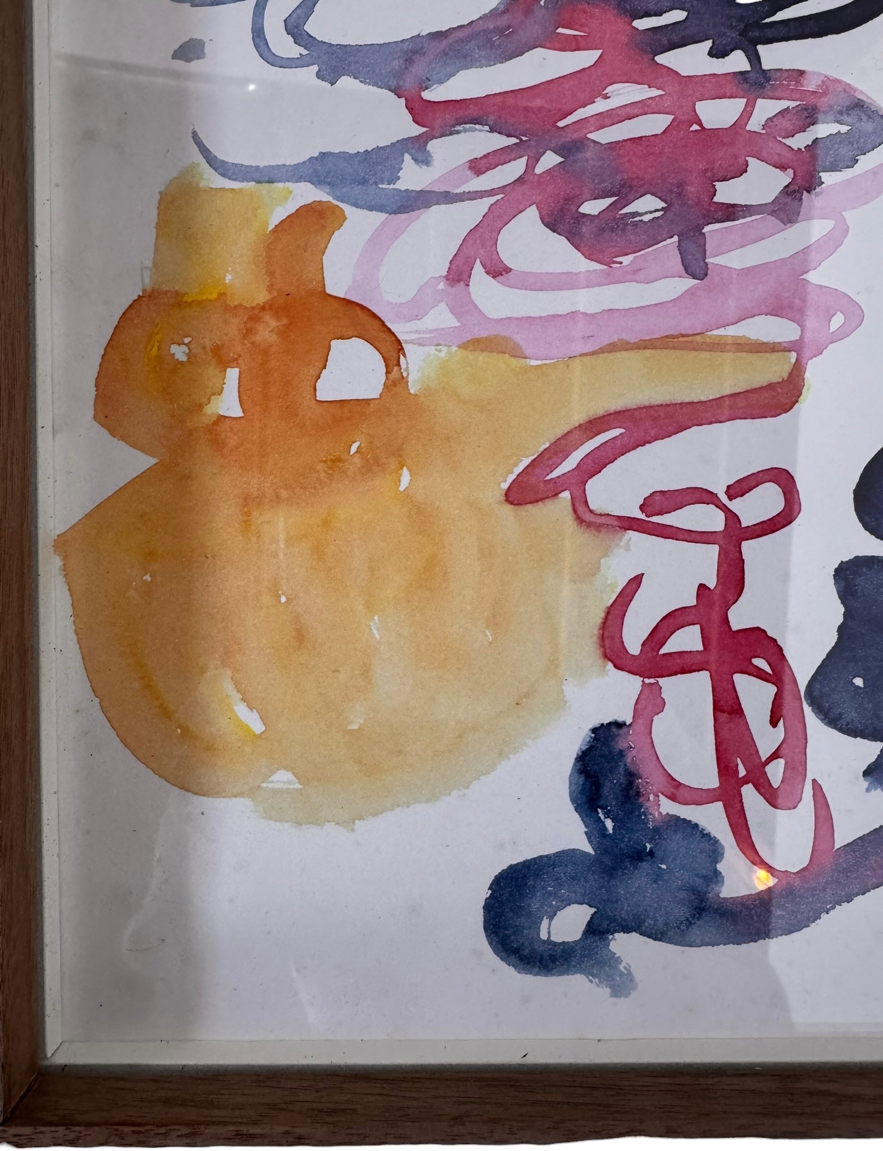 A vertical watercolor painting on paper, framed in a simple dark wood frame. The piece consists of a lively arrangement of gestural, loopy shapes and washes in a warm palette of apricot, magenta, and deep navy blue. The shapes are layered and translucent, with some areas featuring saturated "blooms" of color and others showing thin, wiry line work. The artist's signature and the year '97 are visible in the bottom right corner.