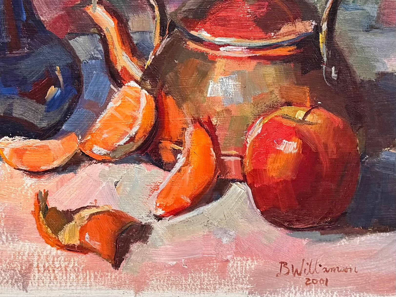 An oil painting still life featuring a copper teapot with a wooden handle, a blue glass vase, a red apple, a whole orange, and several orange slices, all arranged on a white tablecloth against a blurred purple and green background. The artist's signature "B. Willamson 2019" is visible in the bottom right corner.