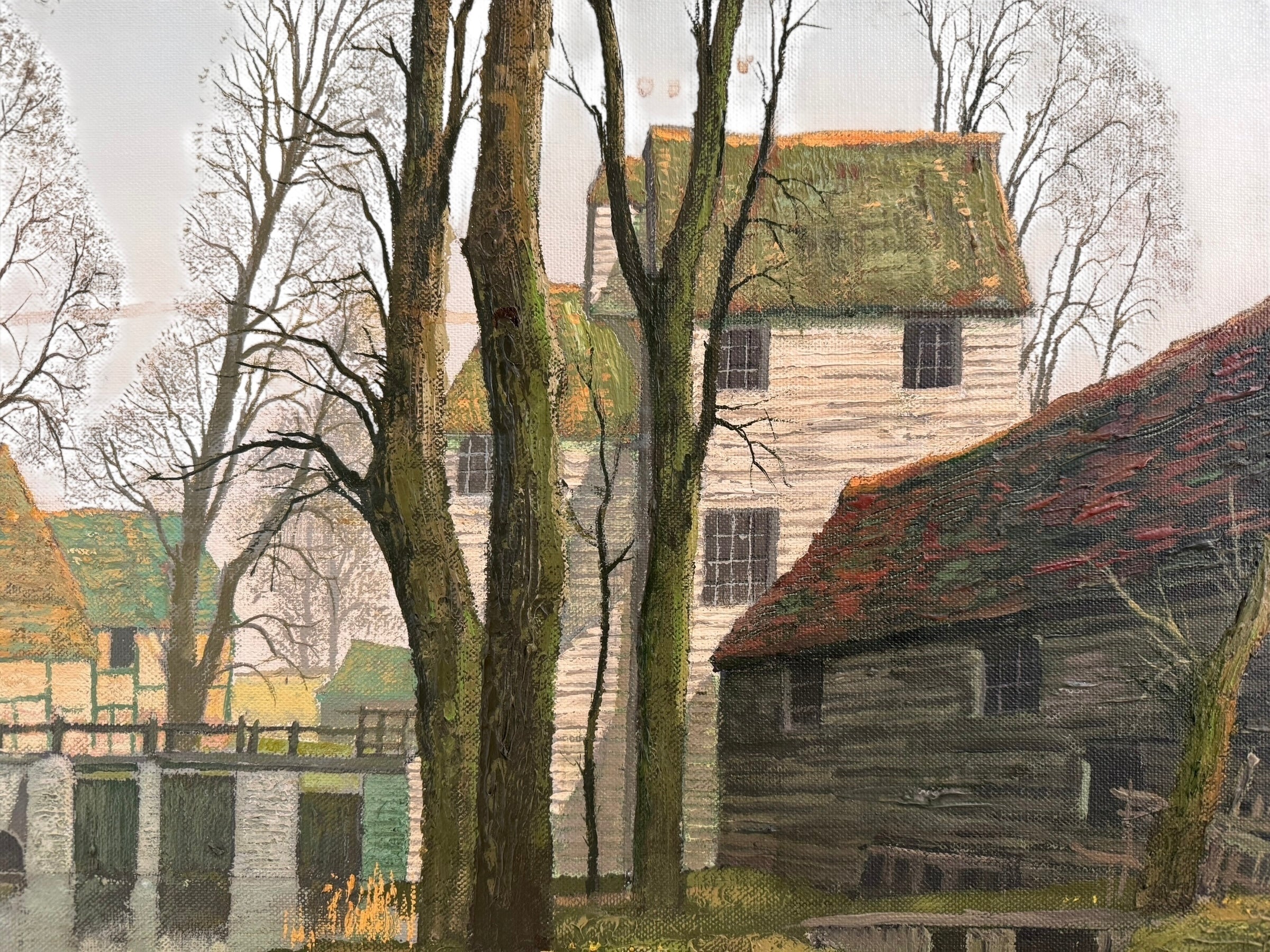 A naturalistic landscape oil painting by Michael Reilly titled "Mill Pond with Bridge" depicts a small town scene with a stone bridge over a mill pond, several buildings, and numerous bare trees under a grey sky