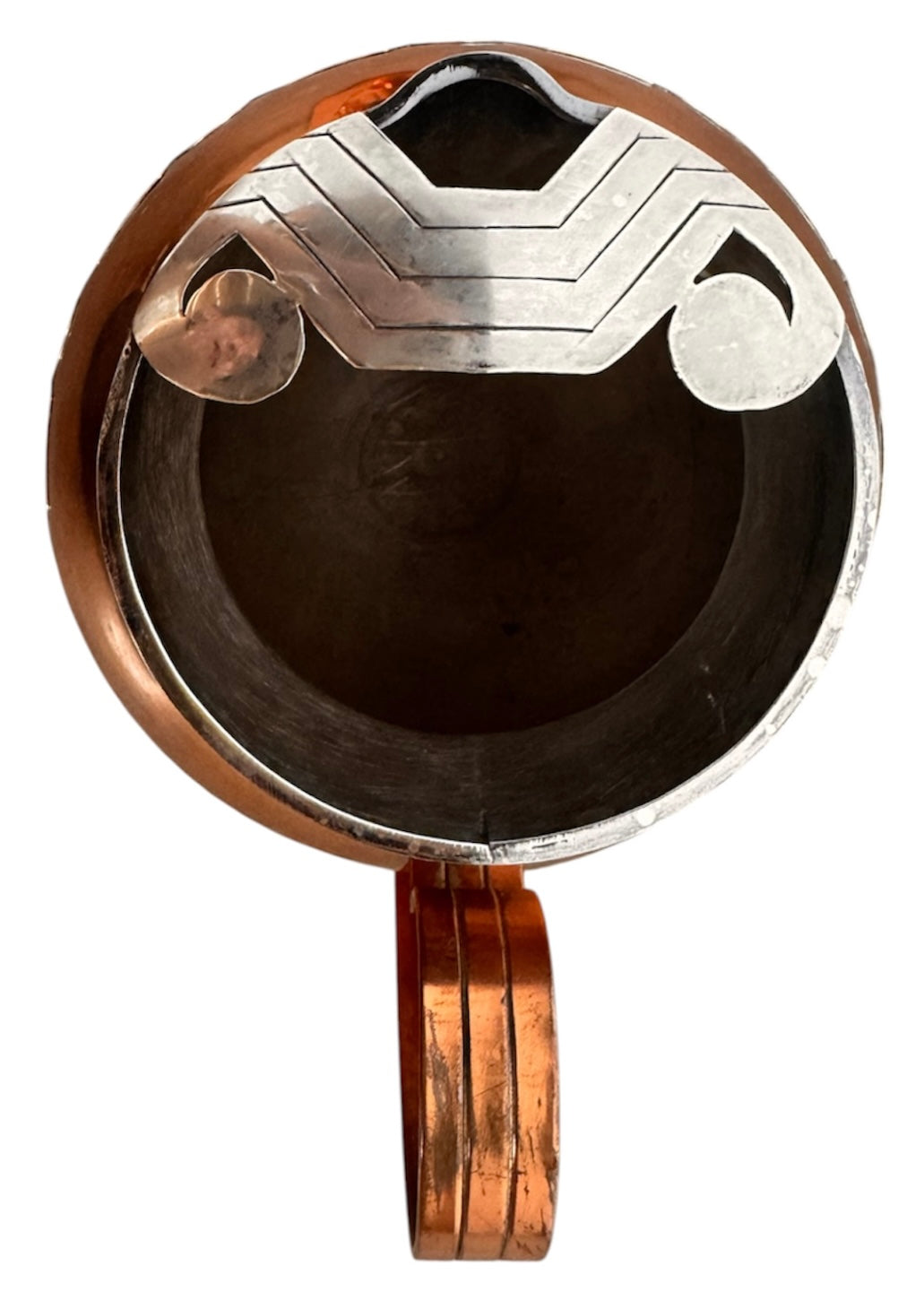 The set includes a large, rectangular, hammered copper tray with geometric openwork handles. Resting on the tray is a tall, slightly tapered copper coffee pot with a wooden handle, a matching smaller creamer pitcher with a similar wooden handle, a lidded sugar bowl, and a tiny matching metal cup or jigger. To the right off the tray sits a large, spherical copper water pitcher or jug with a wide mouth and ice lip.