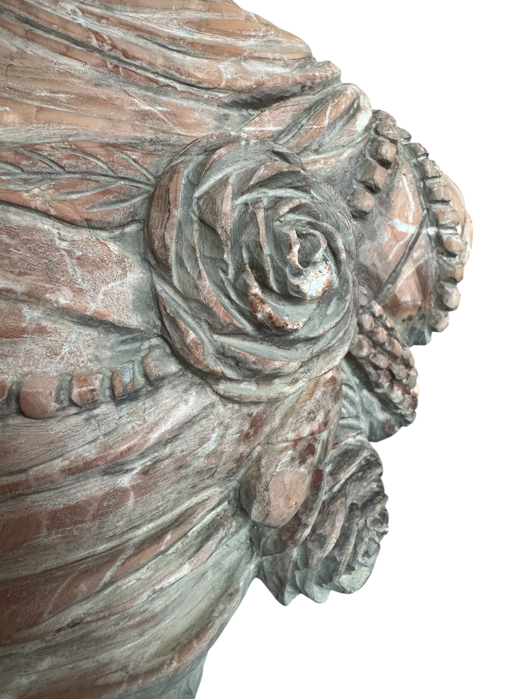 A 25-inch high polychrome marble bust of a woman, featuring white marble for her face and hair, with a base and draped fabric adorned with carved roses and leaves.