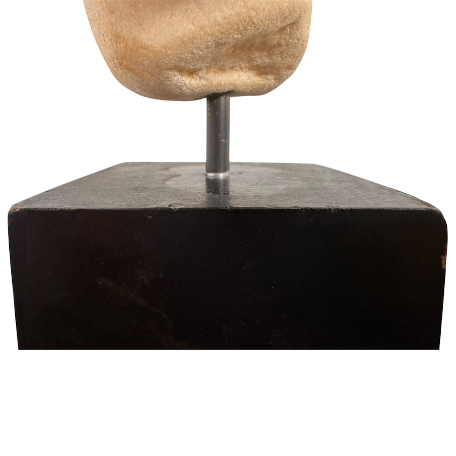 An ancient marble sculpted head of a young man, presented on a modern black presentation stand. The sculpture is rendered in a three-quarter view, angled slightly to the right, showing a classical profile characterized by a strong nose, softly contoured cheekbones, and slightly parted lips that convey a quiet, contemplative expression. The hair is carved in short, stylized strands that frame the forehead and ears, characteristic of ancient Roman or Greek portraiture styles.