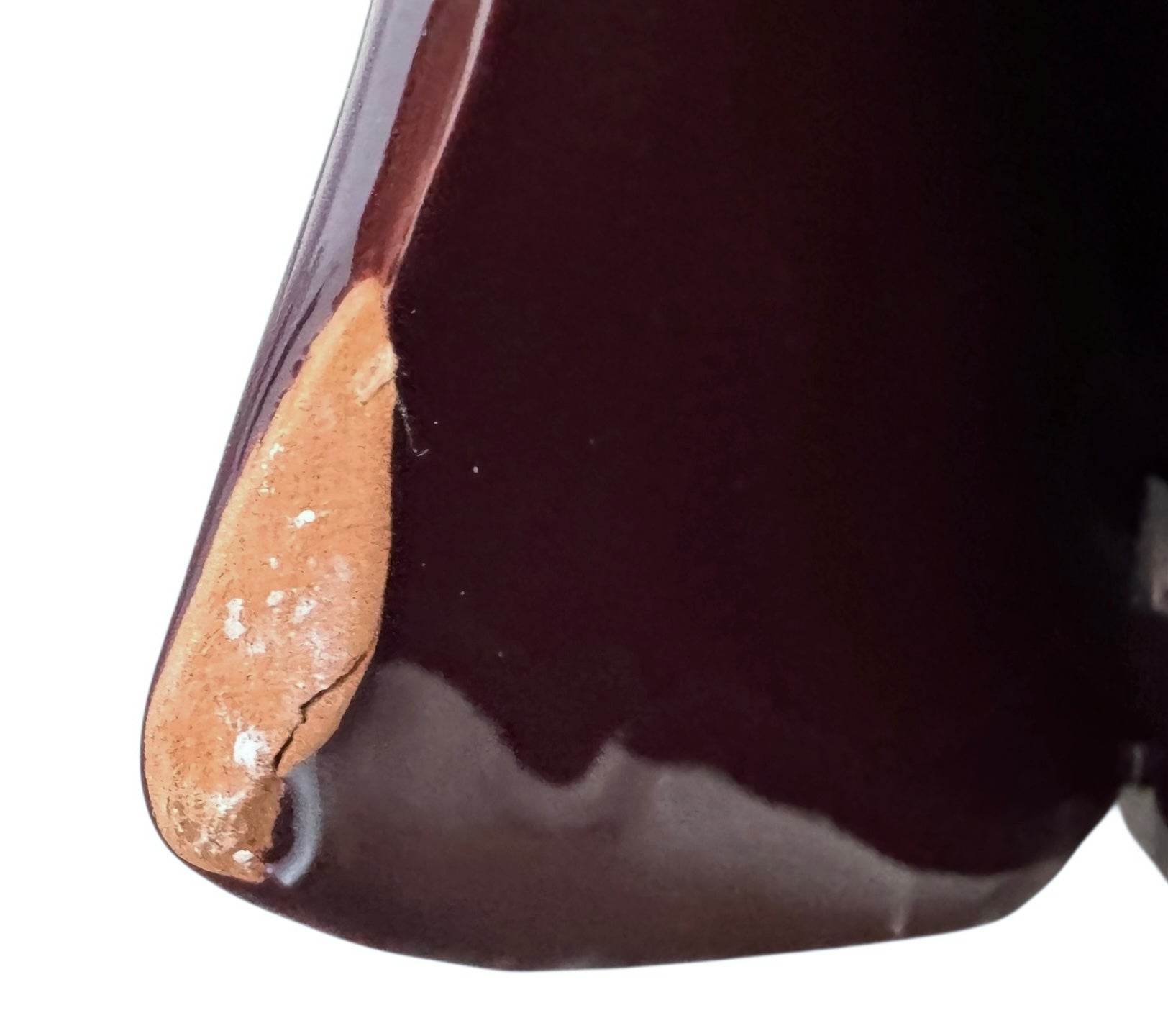 A glossy, dark chocolate brown ceramic bust of a Labrador dog. Created by Enza Fasano, the sculpture features a minimalist, stylized design with smooth, flowing lines and a high-shine glaze that reflects light. The dog’s long ears drape down the sides, and its snout is rounded, capturing the gentle essence of the breed in a contemporary Italian pottery style.