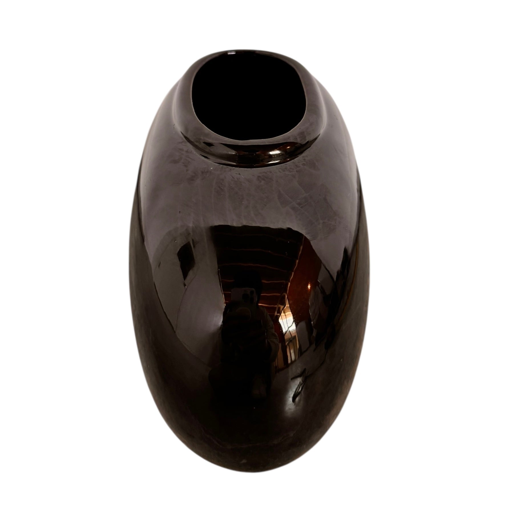 A round, glossy black vase with a small opening.
The vase has a spherical or gourd-like shape and a highly reflective, black glazed finish.