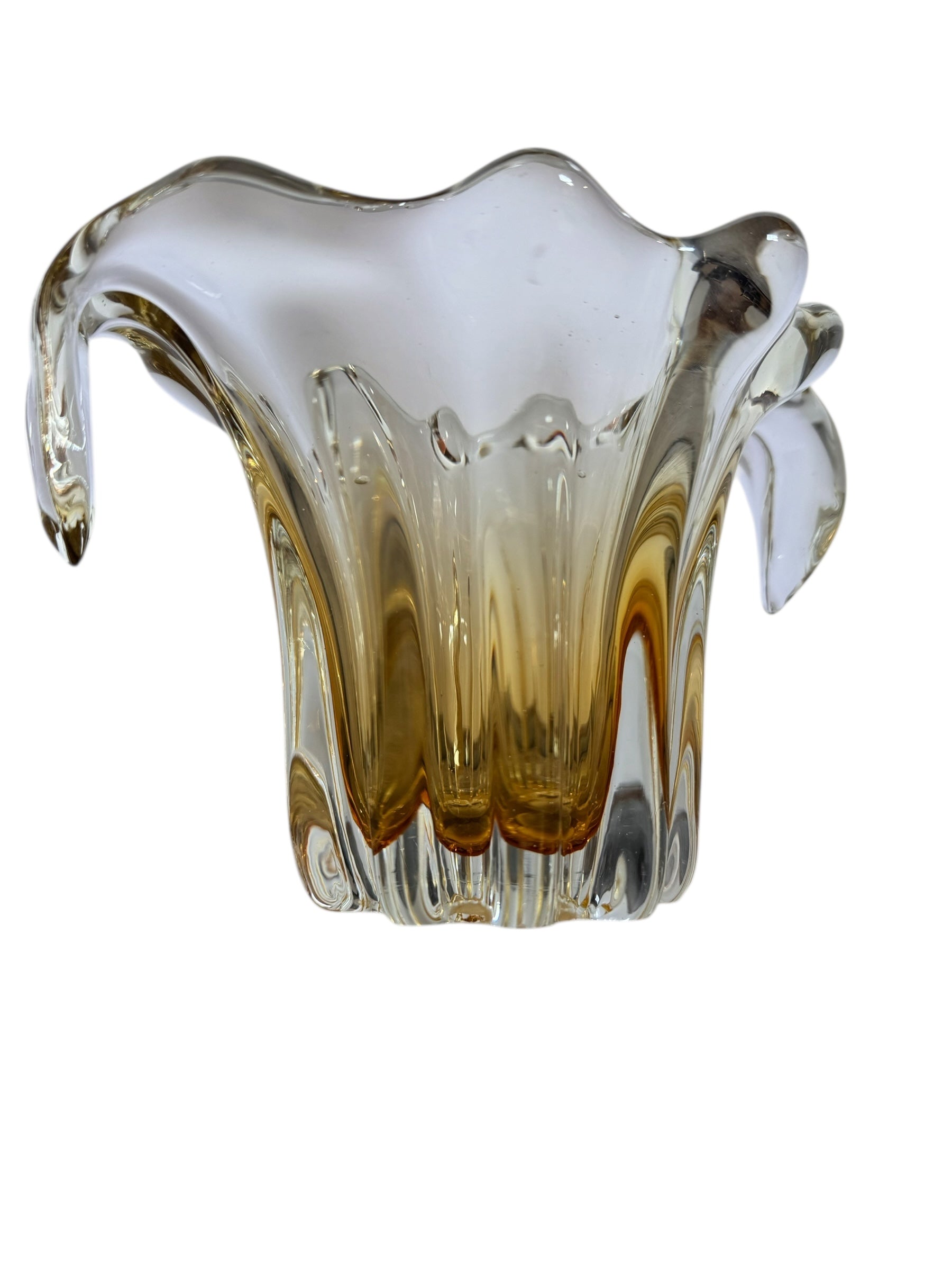 A hand-blown art glass vase with a scalloped, tulip-shaped rim, featuring an amber-to-clear color gradient and a ribbed base