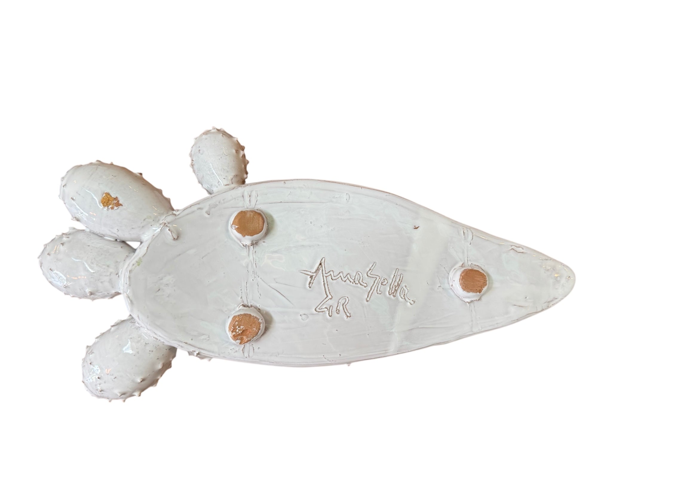 A white glazed ceramic platter in the shape of a prickly pear cactus pad with attached prickly pear fruit. The surface has raised dots representing spines