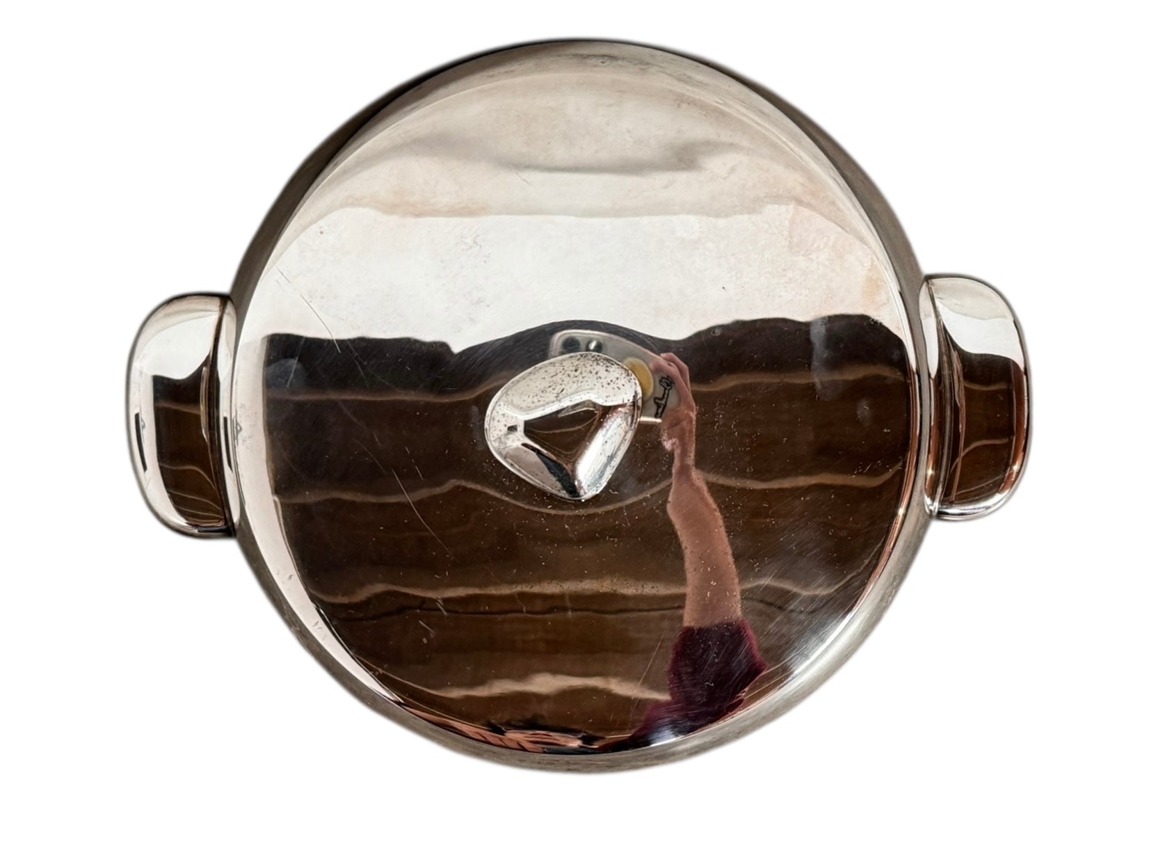 Round St. James silver-plated lidded serving dish from the 1980s, featuring a minimalist modernist design with geometric side handles and a sculptural, biomorphic finial, showing visible vintage wear and pitting on the metallic surface.