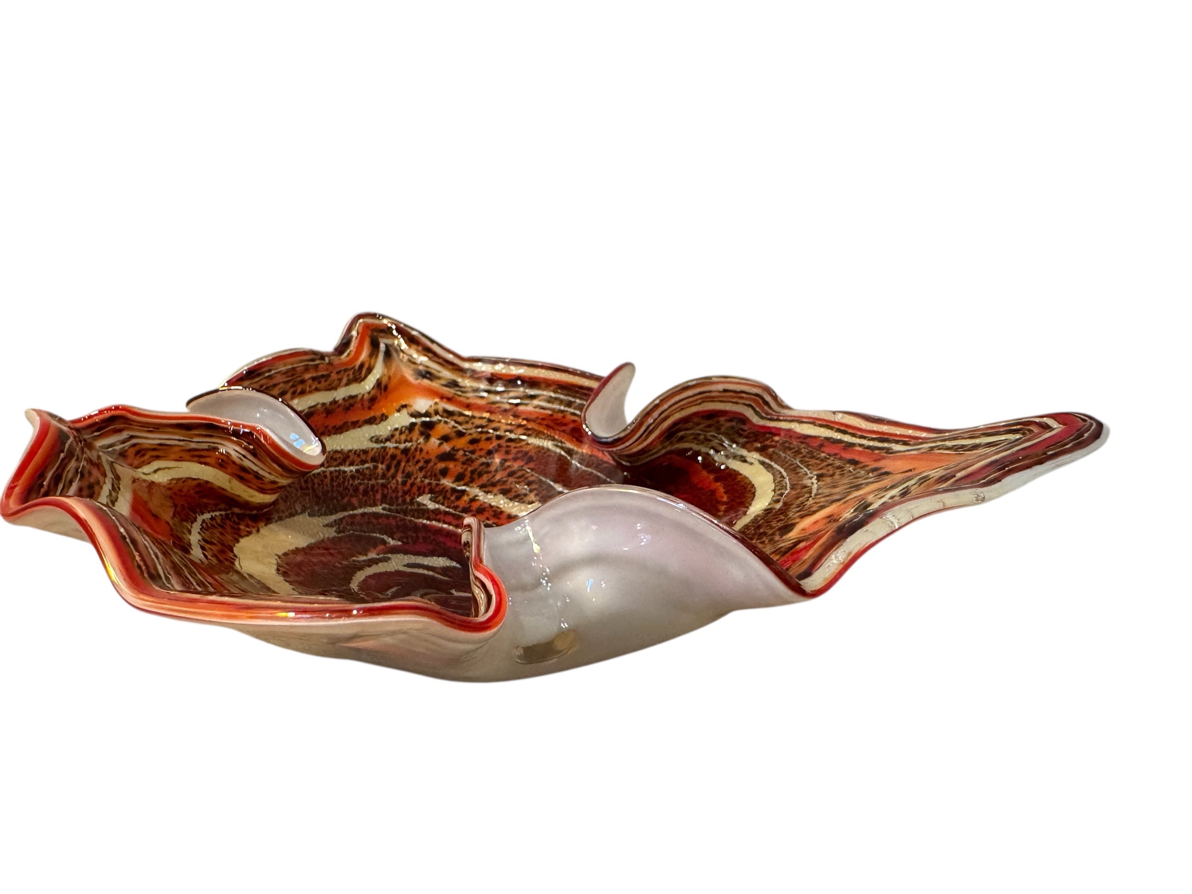 A Murano art glass bowl with a freeform shape, featuring layered swirls of brown, orange, and cream, accented with gold flecks. The bowl has a translucent white base.
