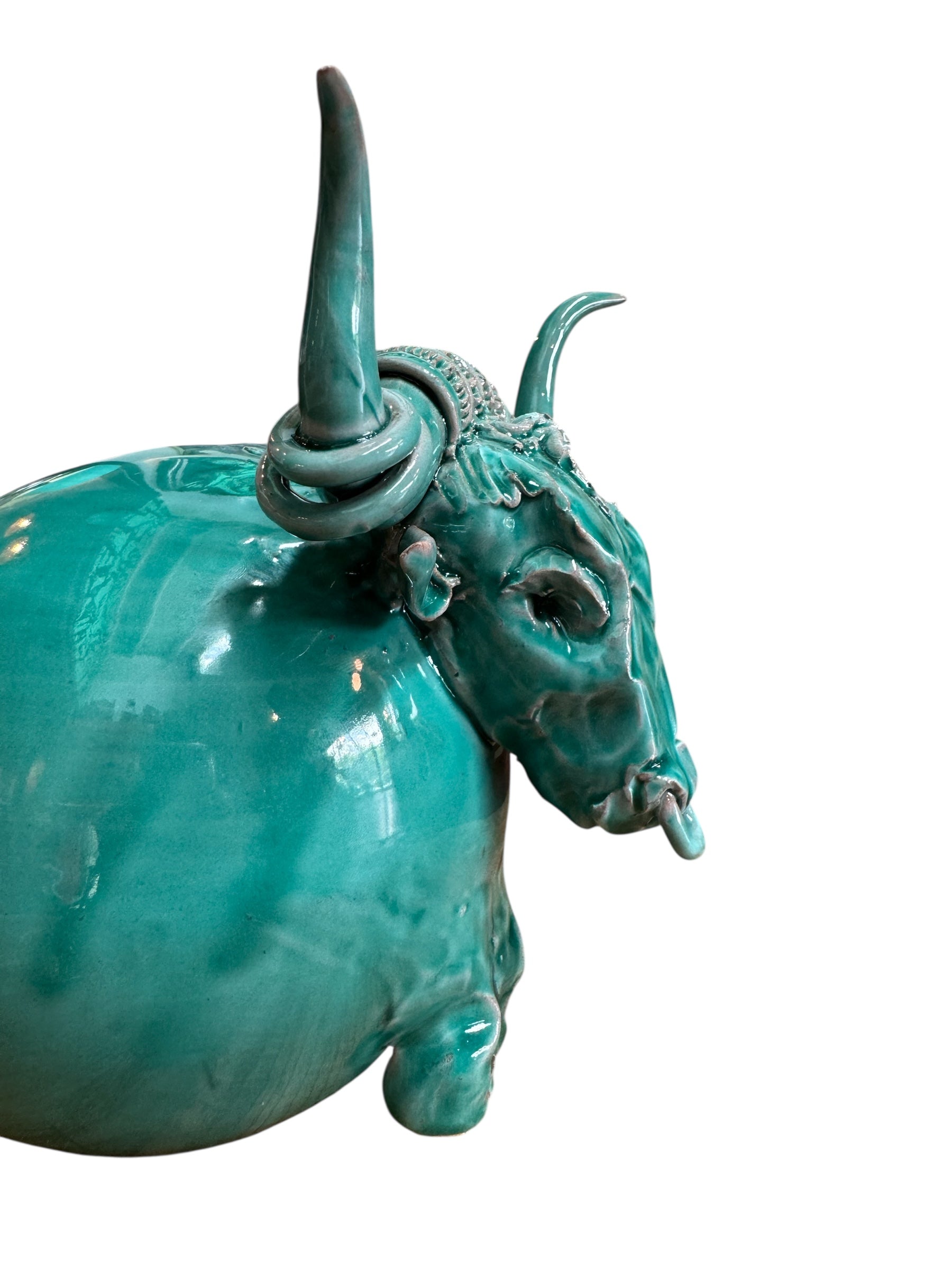 Glossy turquoise ceramic Ankole-Watusi sculpture with long, stylized horns and a nose ring.