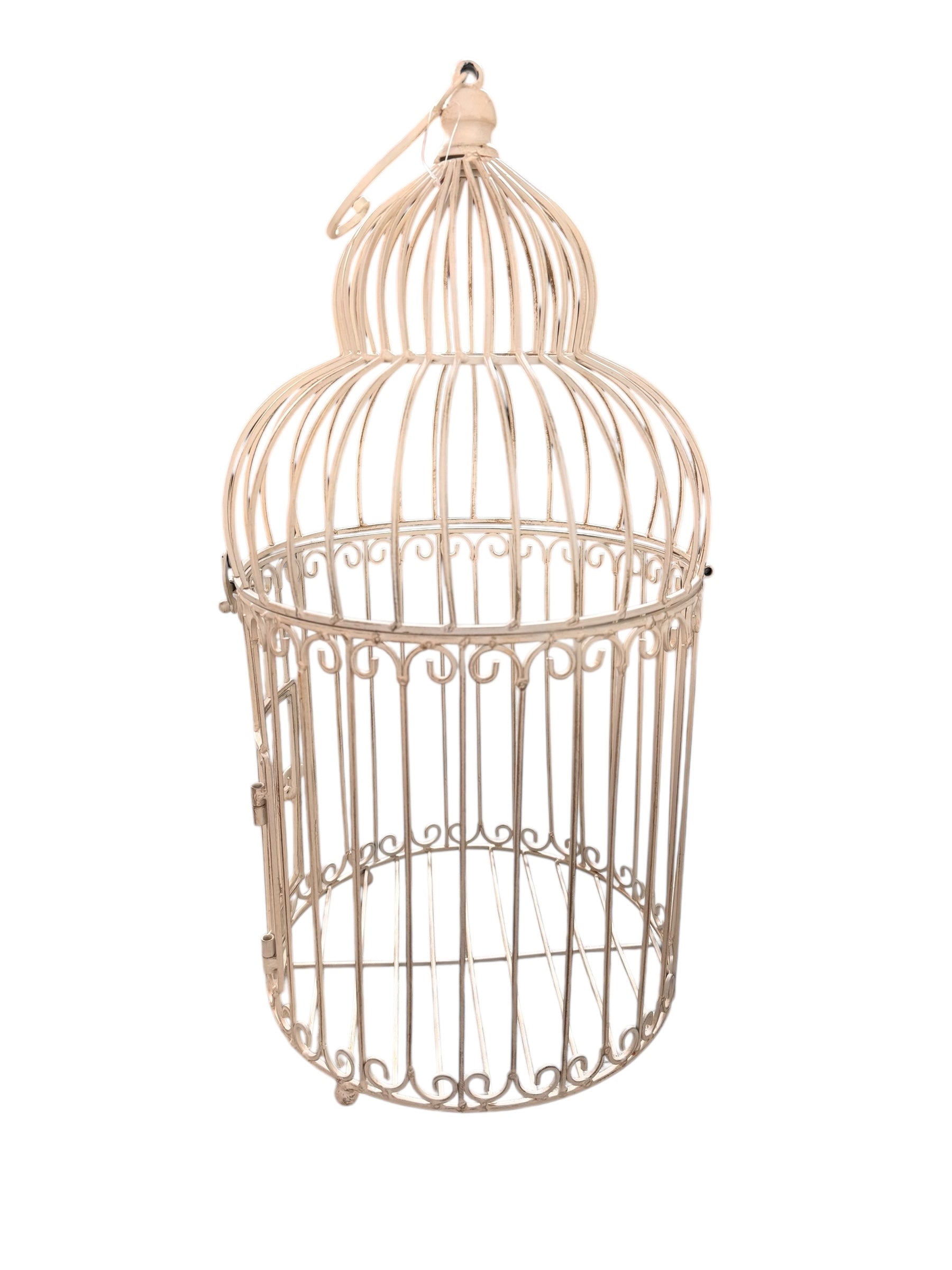 A single, white or cream-colored, decorative wrought iron bird cage with a hinged door and a hanging loop at the top. The cage has a vintage or antique style