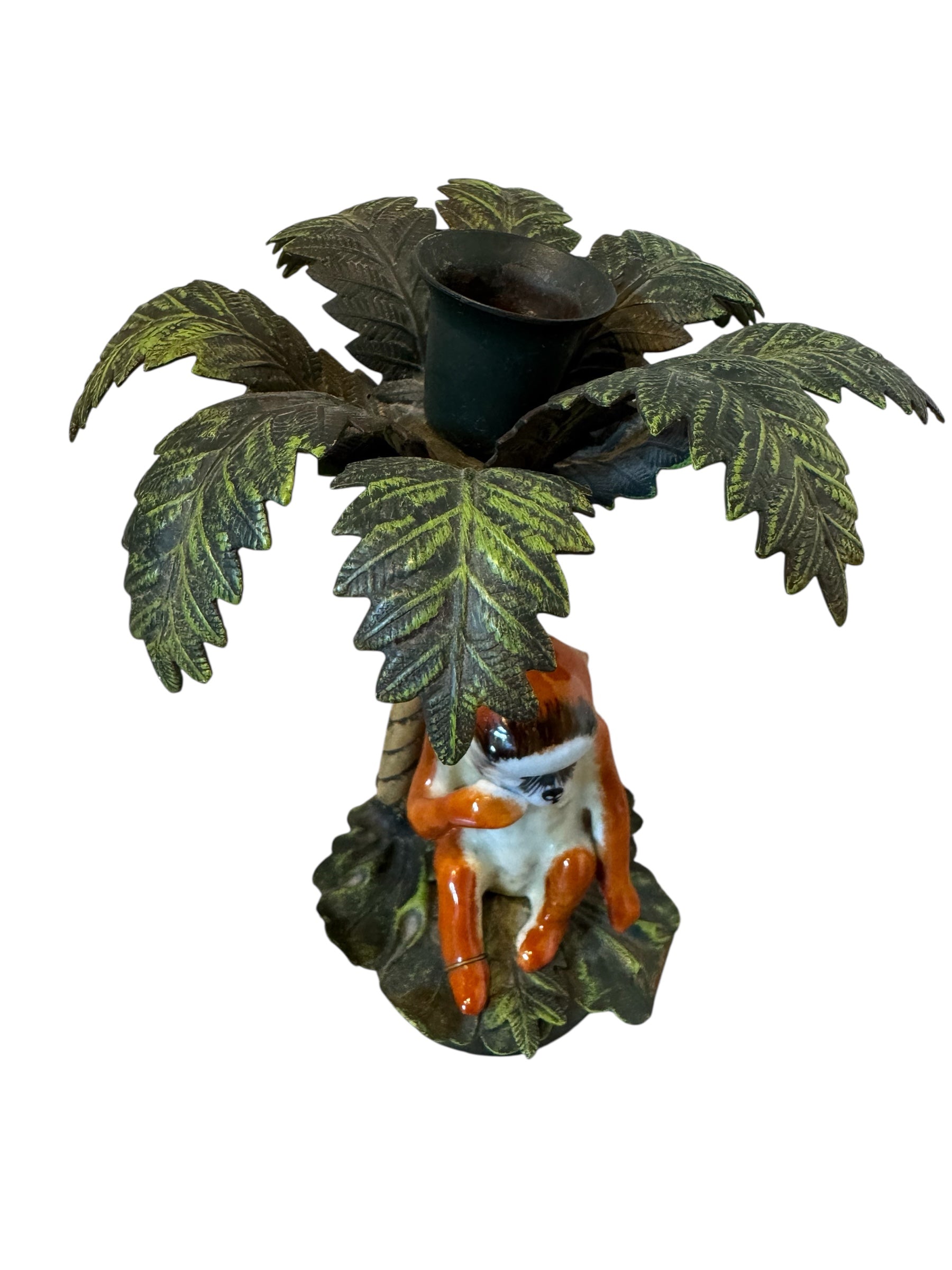 Decorative figurine of a fox sitting under a palm tree with a pot on a white background