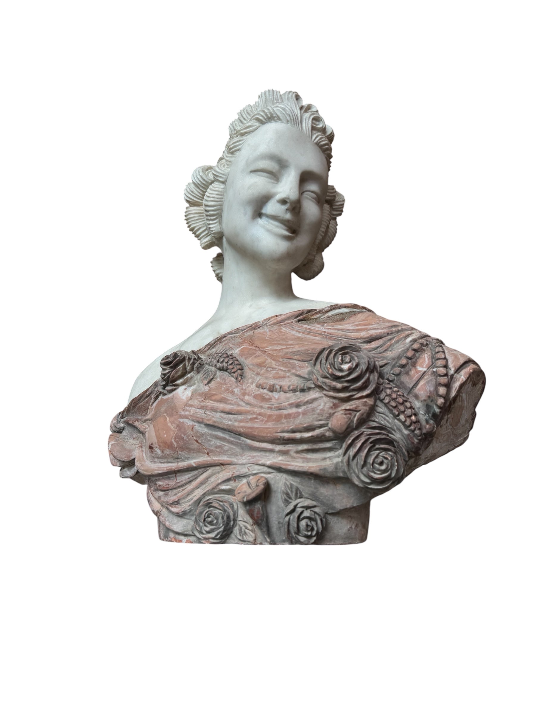 A 25-inch high polychrome marble bust of a woman, featuring white marble for her face and hair, with a base and draped fabric adorned with carved roses and leaves.