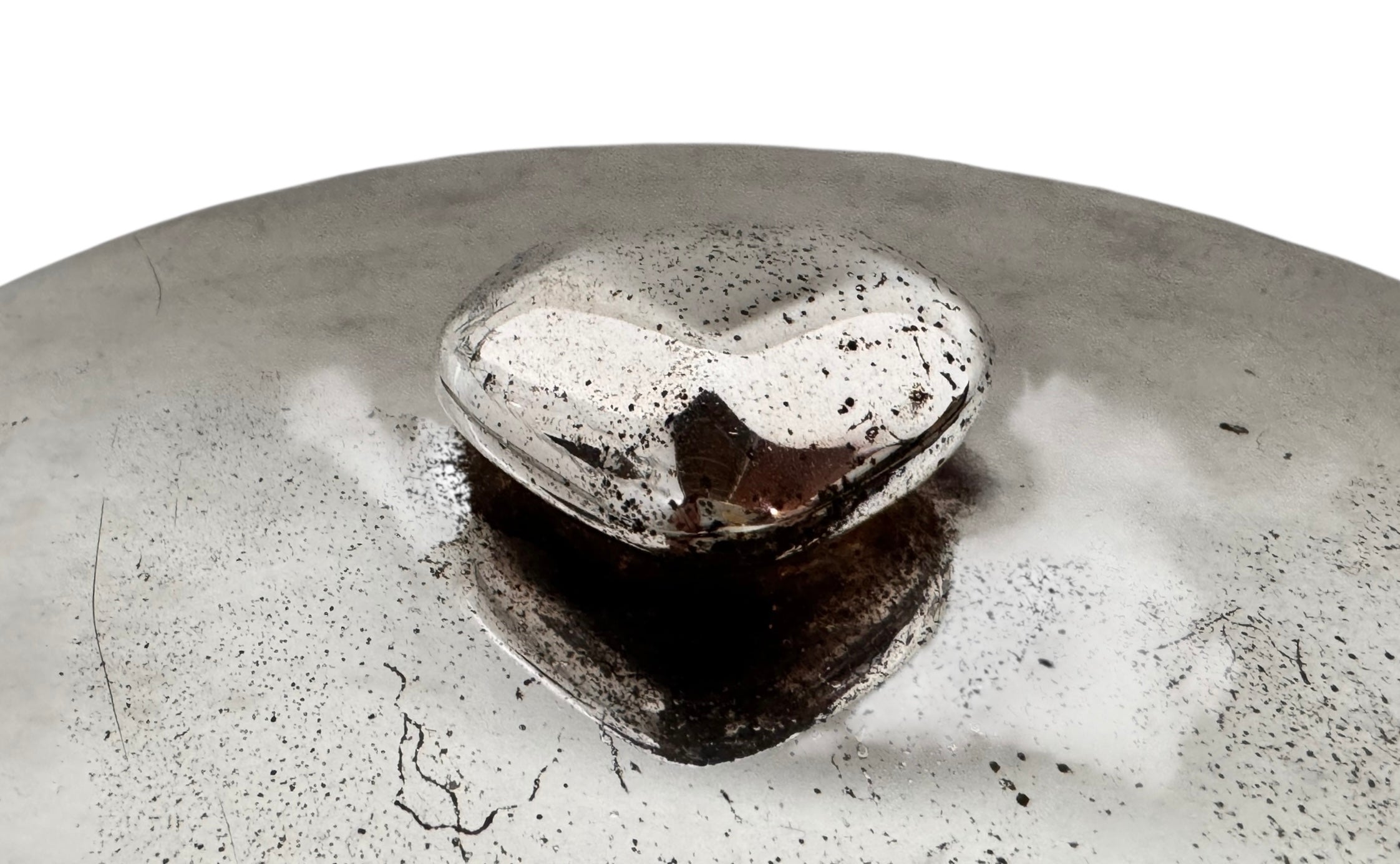 Round St. James silver-plated lidded serving dish from the 1980s, featuring a minimalist modernist design with geometric side handles and a sculptural, biomorphic finial, showing visible vintage wear and pitting on the metallic surface.