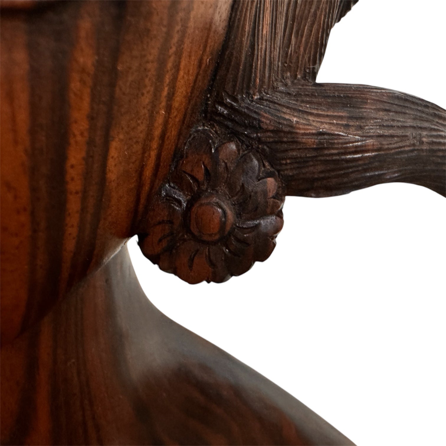 An elegant hand-carved bust of a woman made from rich, polished dark ebony wood with striking reddish-brown grain patterns running vertically through her face and chest. The sculpture features a serene expression with closed eyes, a slender nose, and relaxed lips. Her voluminous, textured hair rises upward in a Fan-like shape, intricately carved with fine lines and adorned with small, delicate flower details. The bust includes her bare shoulders and upper chest, resting on a flat base.