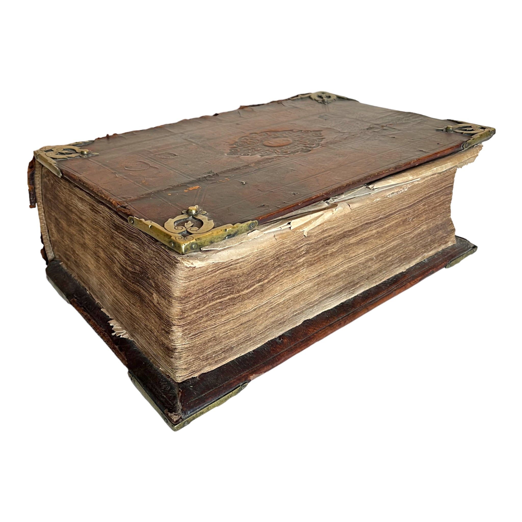 An antique Dutch language illustrated Bible from the 18th century with embossed leather bound wood boards and brass corner mounts.