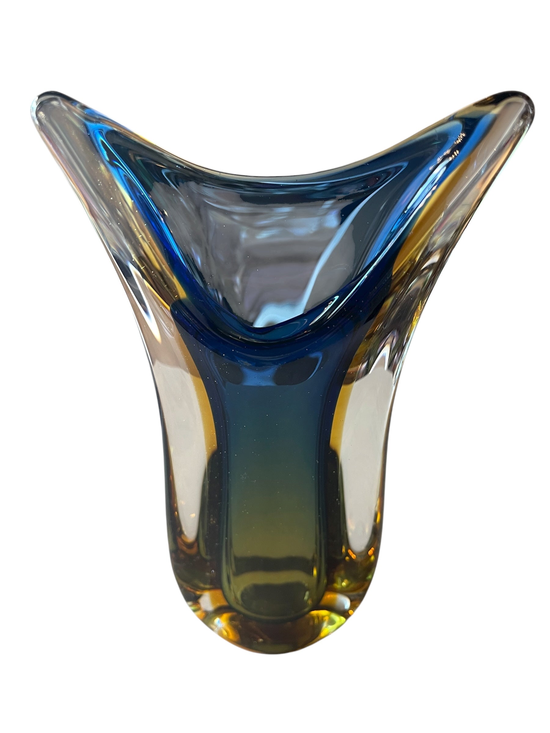 Sculptural art glass vase in the Sommerso style, featuring blue and amber colors encased in a clear glass layer. The vase has a vintage mid-century modern design
