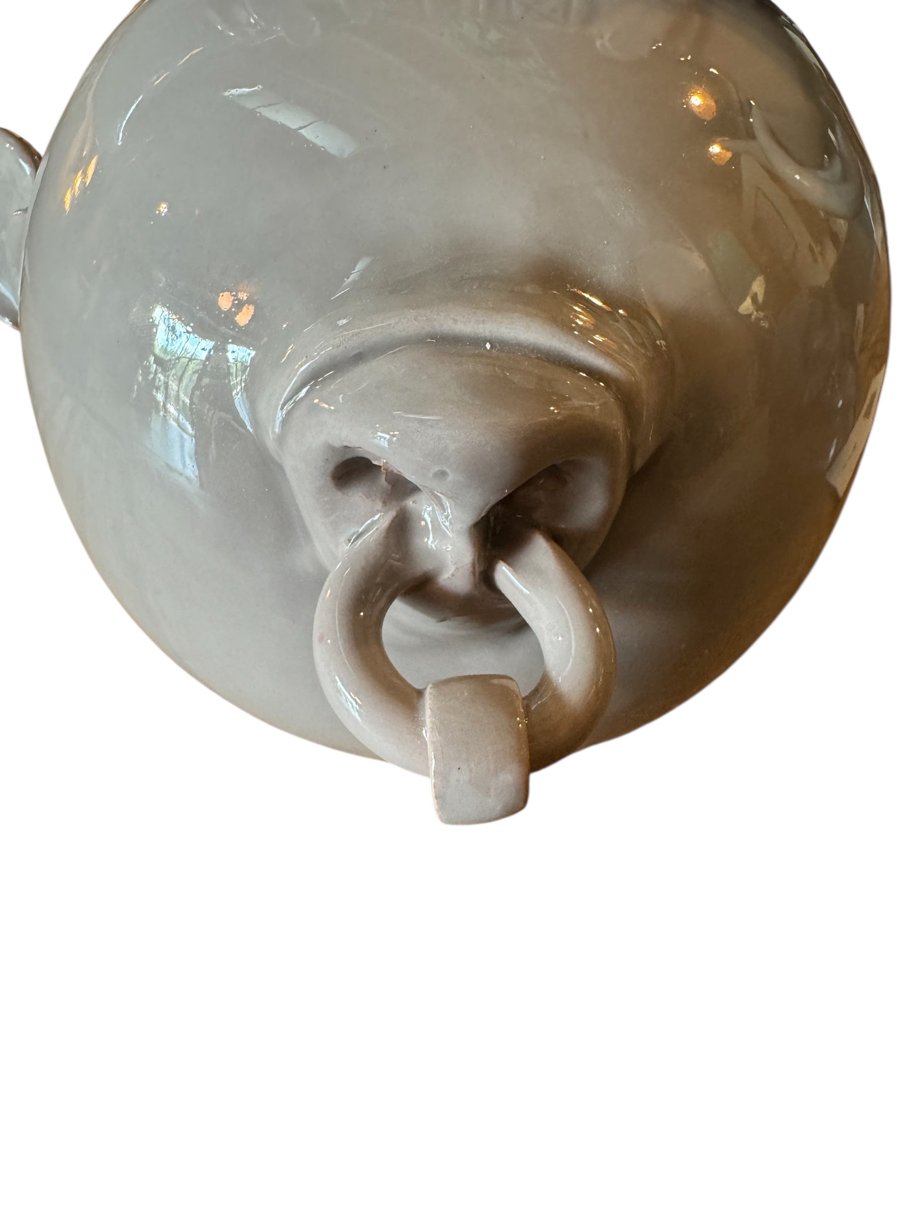 Artistic white grey ceramic bull sculpture by Enza Fasano, featuring a minimalist design and rings on the horns