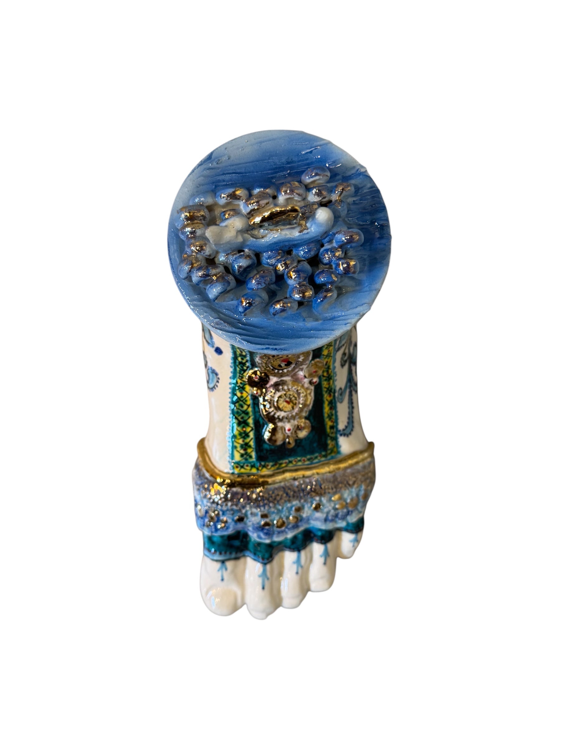 Close-up of Domenico Pinto's 'Mare Dentro' ceramic sculpture: foot, ship with gold sail, Apulian style